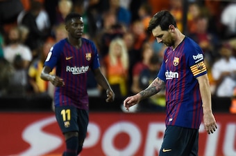 Barcelona's Argentinian forward Lionel Messi (R) looks downwards beside Barcelona's French forward Ousmane Dembele during the Spanish league football match between Valencia CF and FC Barcelona at the Mestalla stadium in Valencia on October 7, 2018. (Photo Barcelona's Argentinian forward Lionel Messi (R) looks downwards beside Barcelona's French forward Ousmane Dembele during the Spanish league football match between Valencia CF and FC Barcelona at the Mestalla stadium in Valencia on October 7, 2018. (Photo
