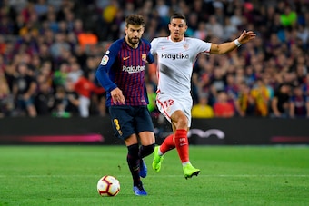 Barcelona's Spanish defender Gerard Pique (L) vies with Sevilla's Portuguese forward Andre Silva during the Spanish league football match FC Barcelona against Sevilla FC at the Camp Nou stadium in Barcelona on October 20, 2018. (Photo by LLUIS GENE / AFP) Barcelona's Spanish defender Gerard Pique (L) vies with Sevilla's Portuguese forward Andre Silva during the Spanish league football match FC Barcelona against Sevilla FC at the Camp Nou stadium in Barcelona on October 20, 2018. (Photo by LLUIS GENE / AFP)