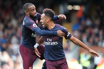 LONDON, ENGLAND - OCTOBER 07: Pierre-Emerick Aubameyang of Arsenal celebrates after scoring a goal to make it 4-1 with Alexandre Lacazette of Arsenal during the Premier League match between Fulham FC and Arsenal FC at Craven Cottage on October 7, 2018 in 