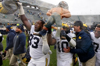 The Wolverines with the Paul Bunyan Trophy