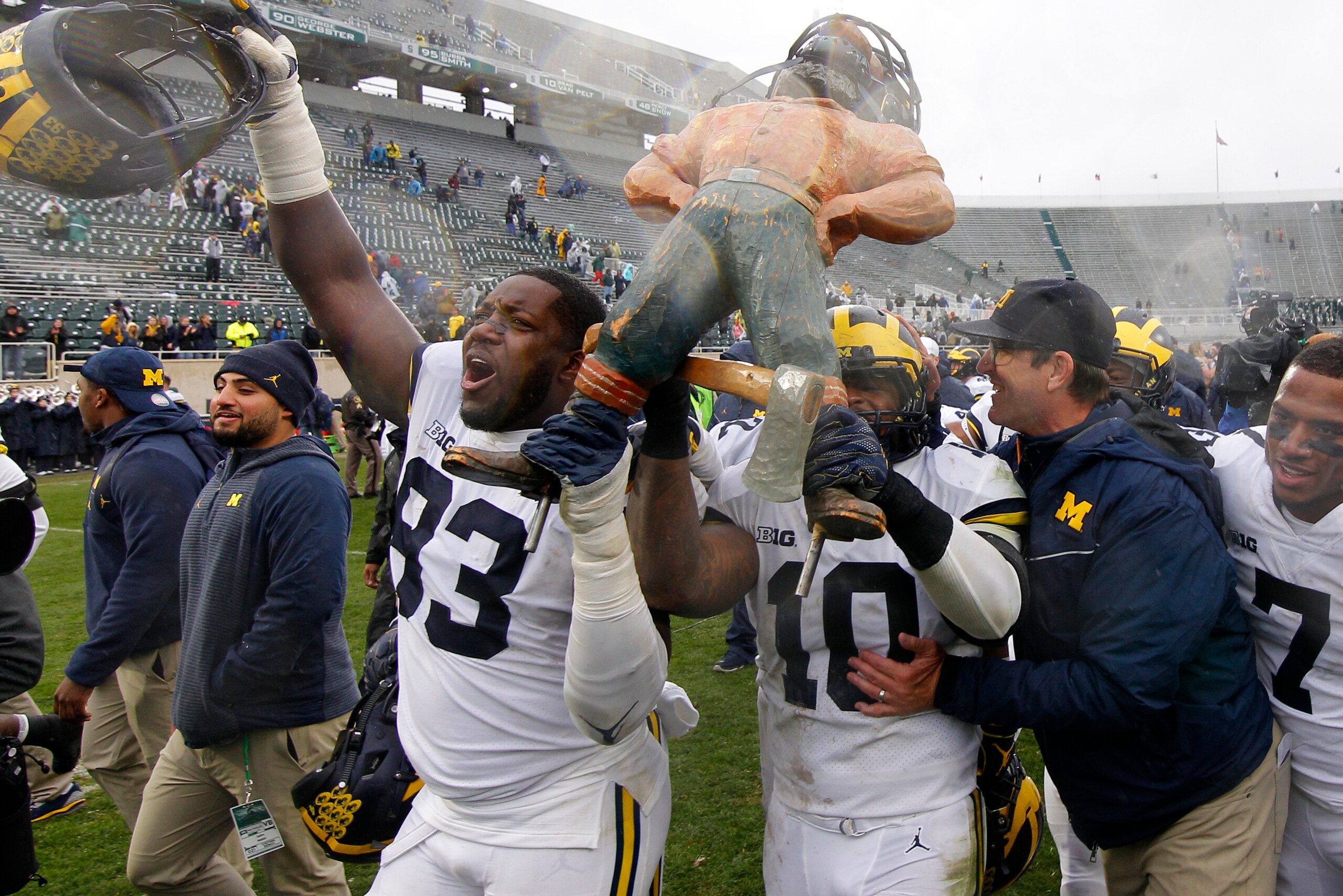 The Wolverines with the Paul Bunyan Trophy
