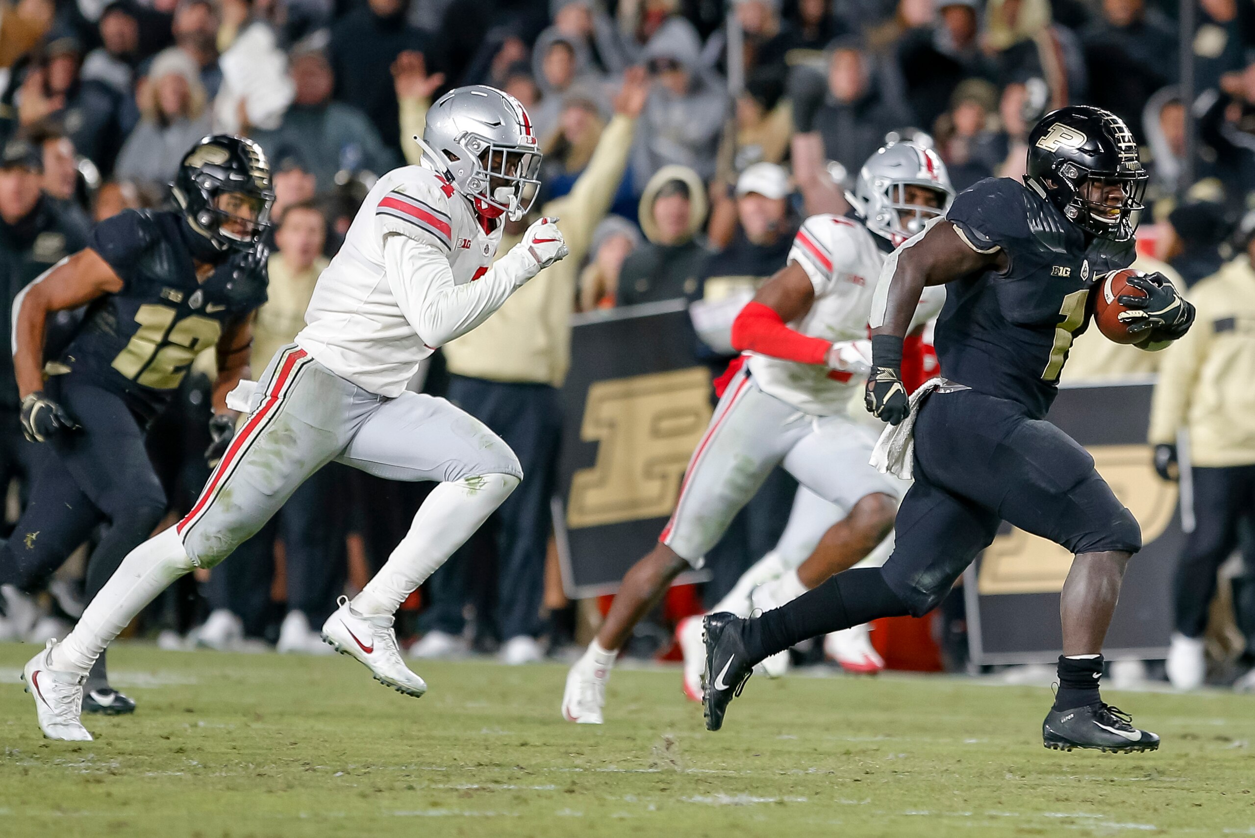 WEST LAFAYETTE, IN - OCTOBER 20: D.J. Knox #1 of the Purdue Boilermakers runs the ball for a touchdown as Jordan Fuller #4 of the Ohio State Buckeyes pursues at Ross-Ade Stadium on October 20, 2018 in West Lafayette, Indiana. (Photo by Michael Hickey/Gett