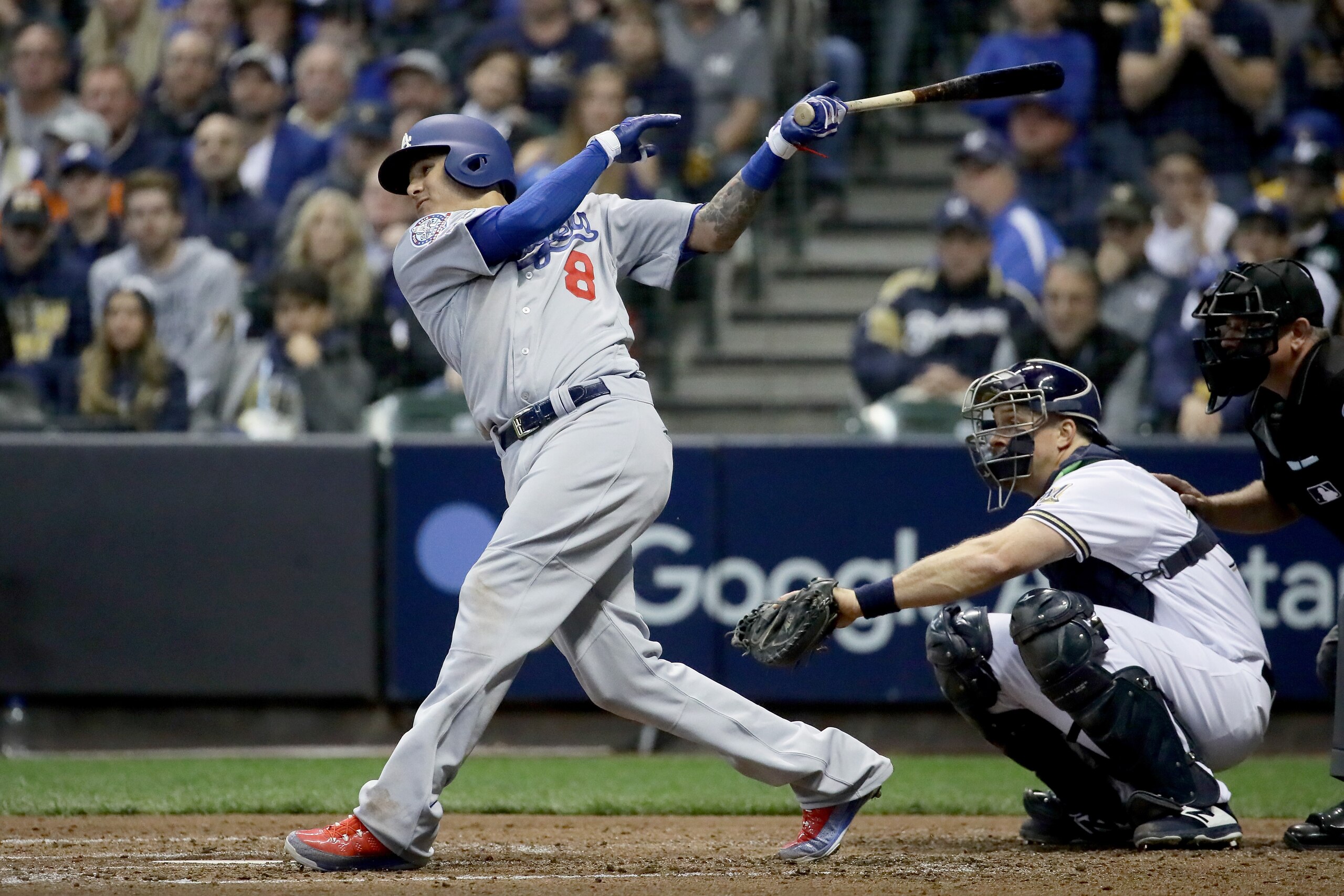 MILWAUKEE, WI - OCTOBER 20: Manny Machado #8 of the Los Angeles Dodgers hits a single against the Milwaukee Brewers during the fourth inning Game Seven of the National League Championship Series at Miller Park on October 20, 2018 in Milwaukee, Wisconsin. MILWAUKEE, WI - OCTOBER 20: Manny Machado #8 of the Los Angeles Dodgers hits a single against the Milwaukee Brewers during the fourth inning Game Seven of the National League Championship Series at Miller Park on October 20, 2018 in Milwaukee, Wisconsin.