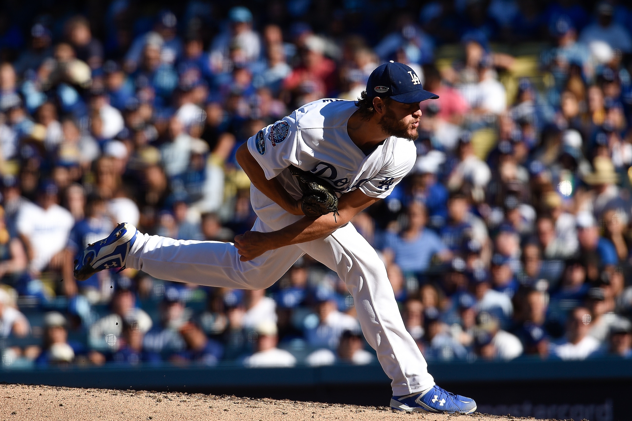LOS ANGELES, CA - OCTOBER 17:  Clayton Kershaw #22 of the Los Angeles Dodgers delivers a pitch in the fourth inning against the Milwaukee Brewers in Game Five of the National League Championship Series at Dodger Stadium on October 17, 2018 in Los Angeles,