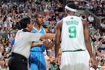 BOSTON - NOVEMBER 1:  Rajon Rondo #9 of Boston Celtics talks to Chris Paul #3 of the New Orleans Hornets on November 1, 2009 at the TD Garden in Boston, Massachusetts.  NOTE TO USER: User expressly acknowledges and agrees that, by downloading and or using