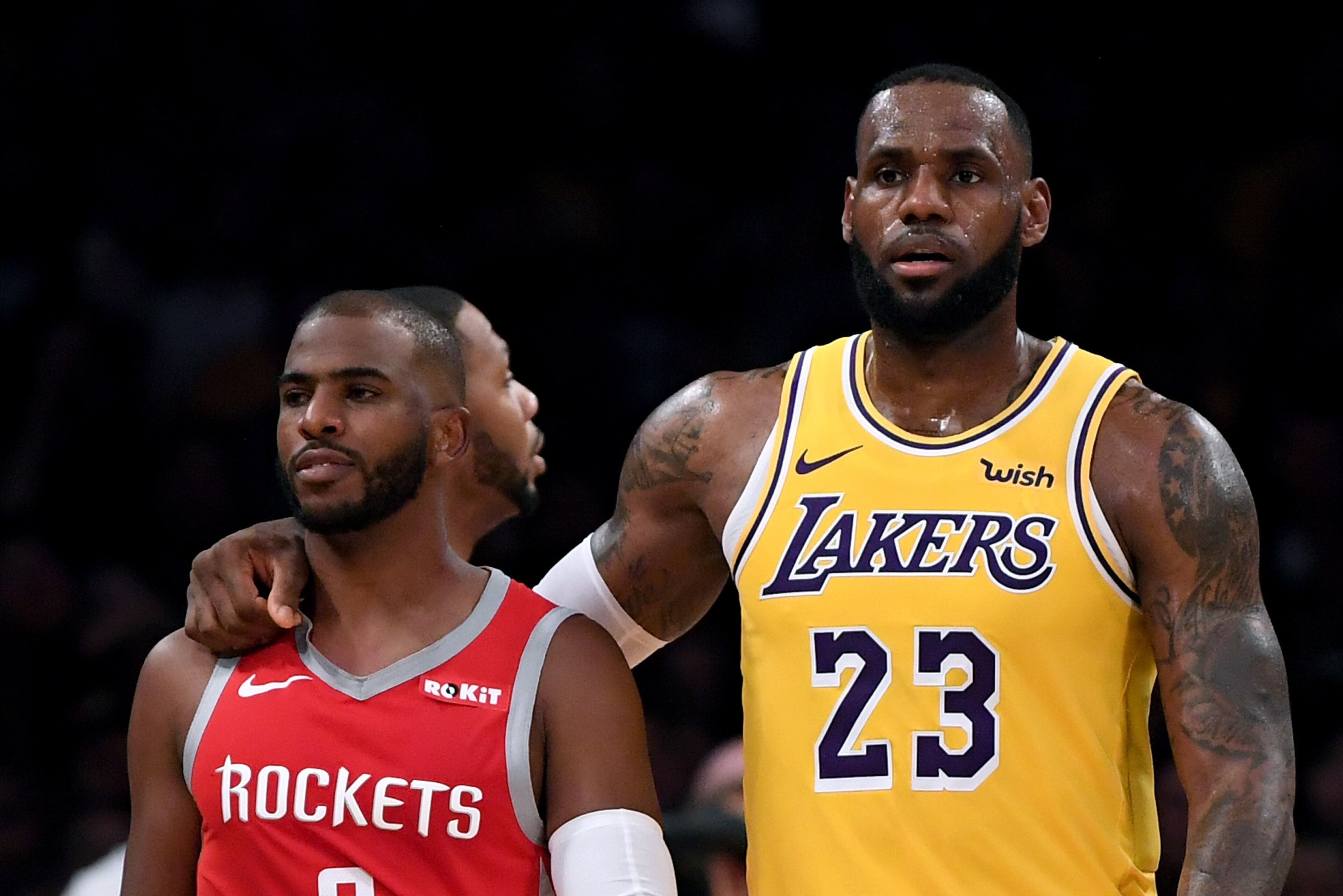 LOS ANGELES, CA - OCTOBER 20:  LeBron James #23 of the Los Angeles Lakers escorts Chris Paul #3 of the Houston Rockets after a fight involving Rajon Rondo #9 and Brandon Ingram #14 during a 124-115 Rockets win at Staples Center on October 20, 2018 in Los 