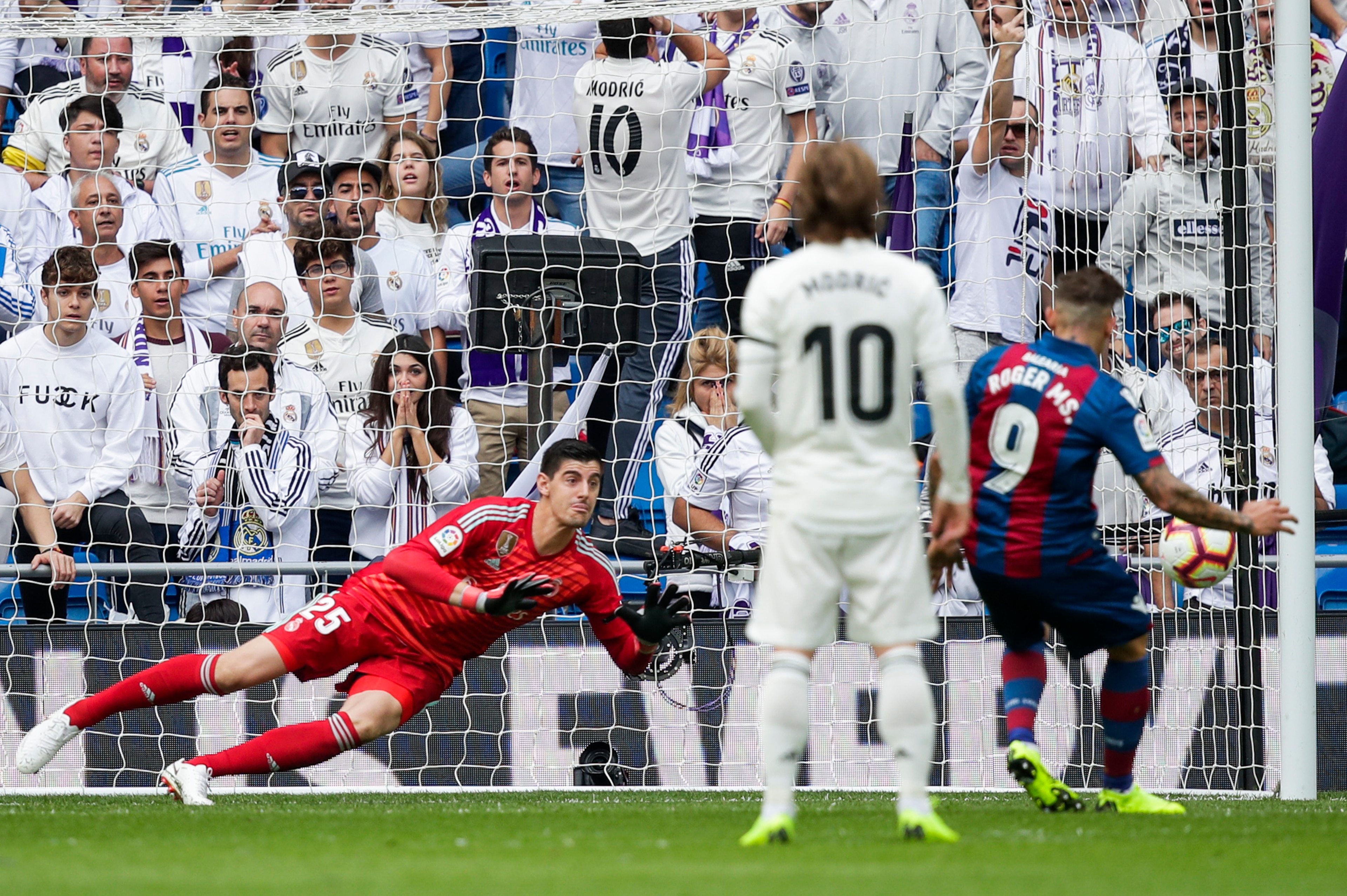 MADRID, SPAIN - OCTOBER 20: supporters of Real  Madrid, Thibaut Courtois of Real Madrid, Luka Modric of Real Madrid, Roger Marti of Levante UD during the La Liga Santander  match between Real Madrid v Levante at the Santiago Bernabeu on October 20, 2018 i