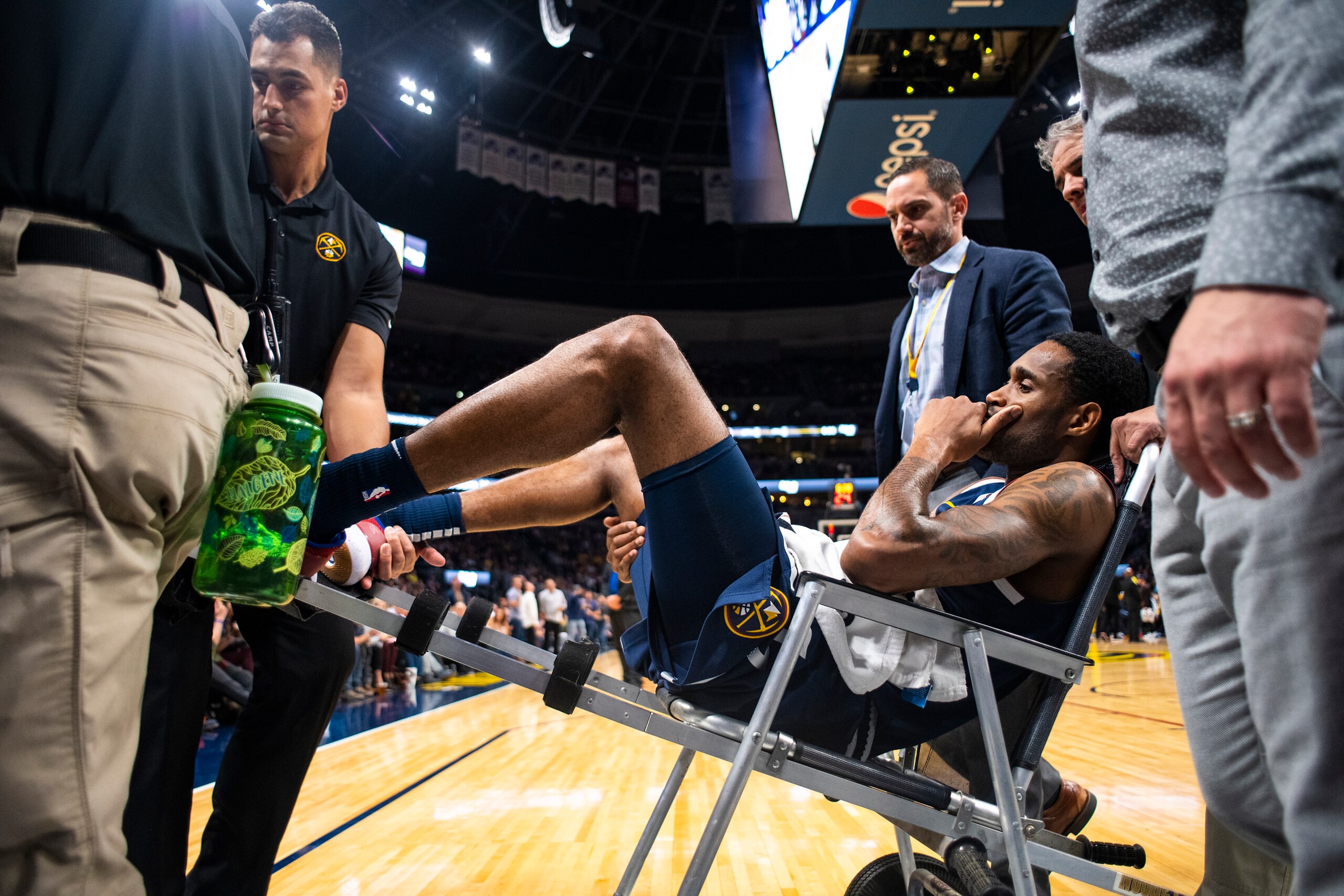 DENVER, CO - OCTOBER 20: Will Barton #5 of the Denver Nuggets is carted off following a hip injury during the second half against the Phoenix Suns at Pepsi Center on October 20, 2018 in Denver, Colorado. NOTE TO USER: User expressly acknowledges and agree
