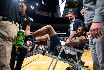 DENVER, CO - OCTOBER 20: Will Barton #5 of the Denver Nuggets is carted off following a hip injury during the second half against the Phoenix Suns at Pepsi Center on October 20, 2018 in Denver, Colorado. NOTE TO USER: User expressly acknowledges and agree DENVER, CO - OCTOBER 20: Will Barton #5 of the Denver Nuggets is carted off following a hip injury during the second half against the Phoenix Suns at Pepsi Center on October 20, 2018 in Denver, Colorado. NOTE TO USER: User expressly acknowledges and agree