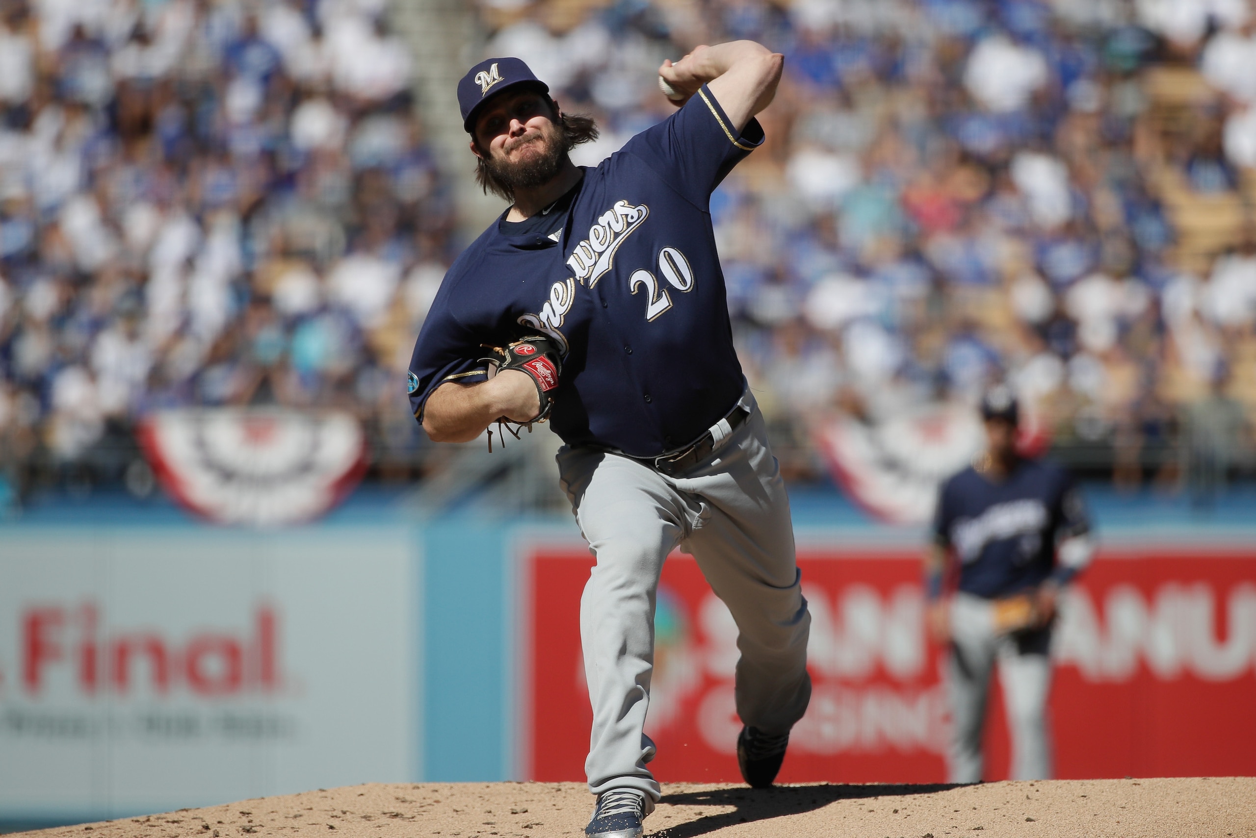 LOS ANGELES, CA - OCTOBER 17:  Pitcher Wade Miley #20 of the Milwaukee Brewers pitches during the first inning of Game Five of the National League Championship Series against the Los Angeles Dodgers at Dodger Stadium on October 17, 2018 in Los Angeles, Ca