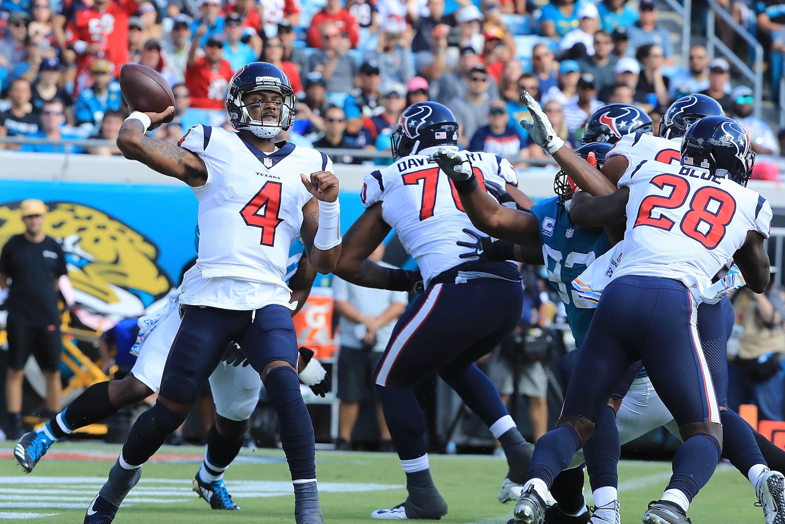 JACKSONVILLE, FL - OCTOBER 21:  Deshaun Watson #4 of the Houston Texans attempts a pass during the game against the Jacksonville Jaguars at TIAA Bank Field on October 21, 2018 in Jacksonville, Florida.  (Photo by Sam Greenwood/Getty Images)