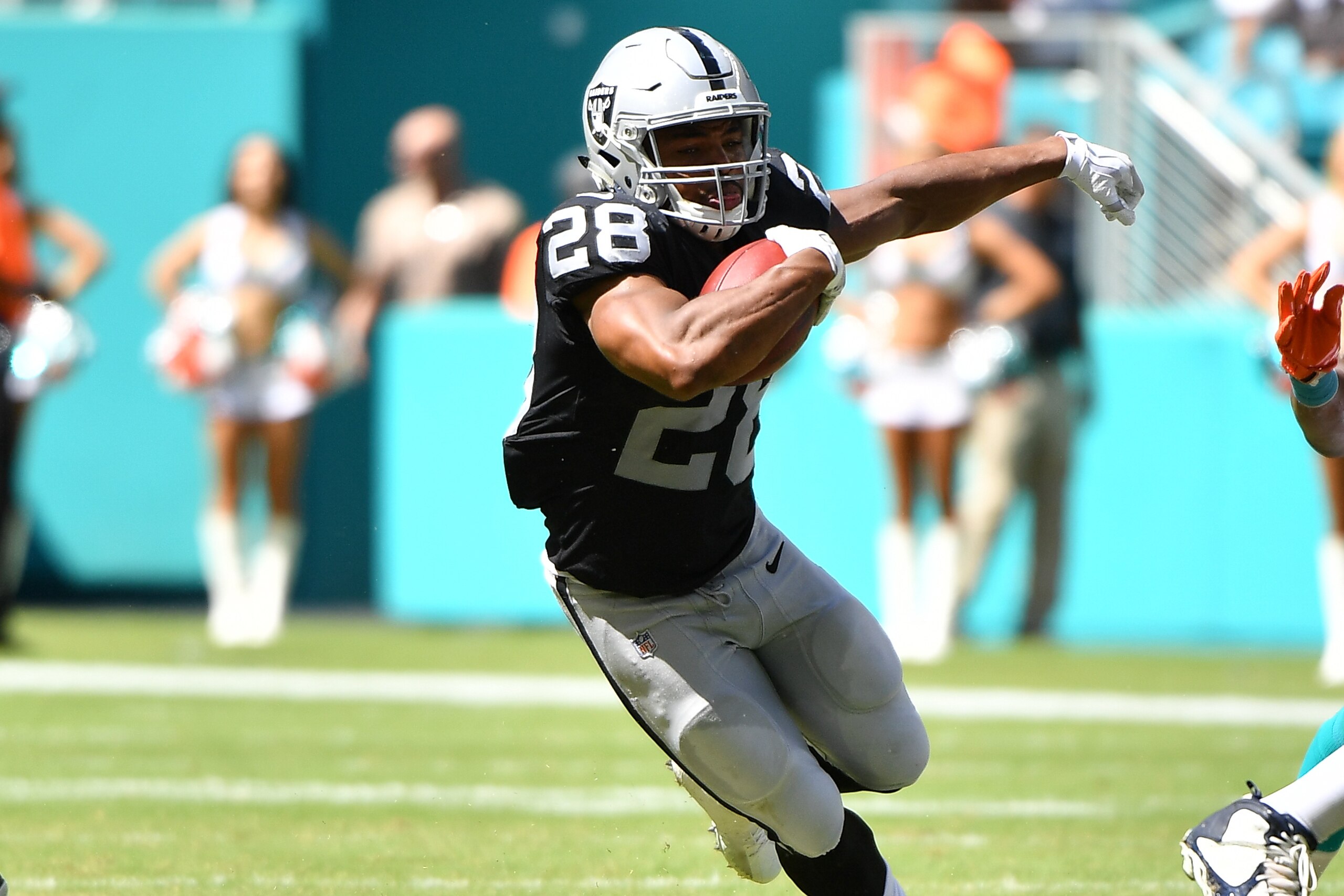 MIAMI, FL - SEPTEMBER 23: Doug Martin #28 of the Oakland Raiders runs with the ball against the Miami Dolphins at Hard Rock Stadium on September 23, 2018 in Miami, Florida. (Photo by Mark Brown/Getty Images)