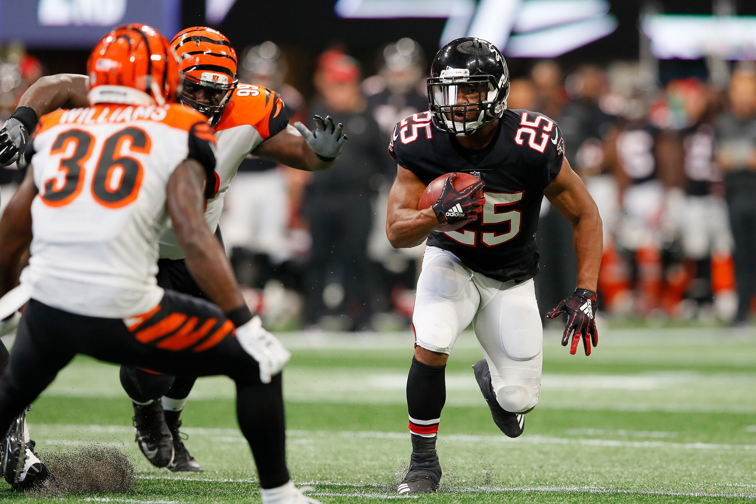 ATLANTA, GA - SEPTEMBER 30: Ito Smith #25 of the Atlanta Falcons runs the ball during the second quarter against the Cincinnati Bengals at Mercedes-Benz Stadium on September 30, 2018 in Atlanta, Georgia. (Photo by Kevin C. Cox/Getty Images)