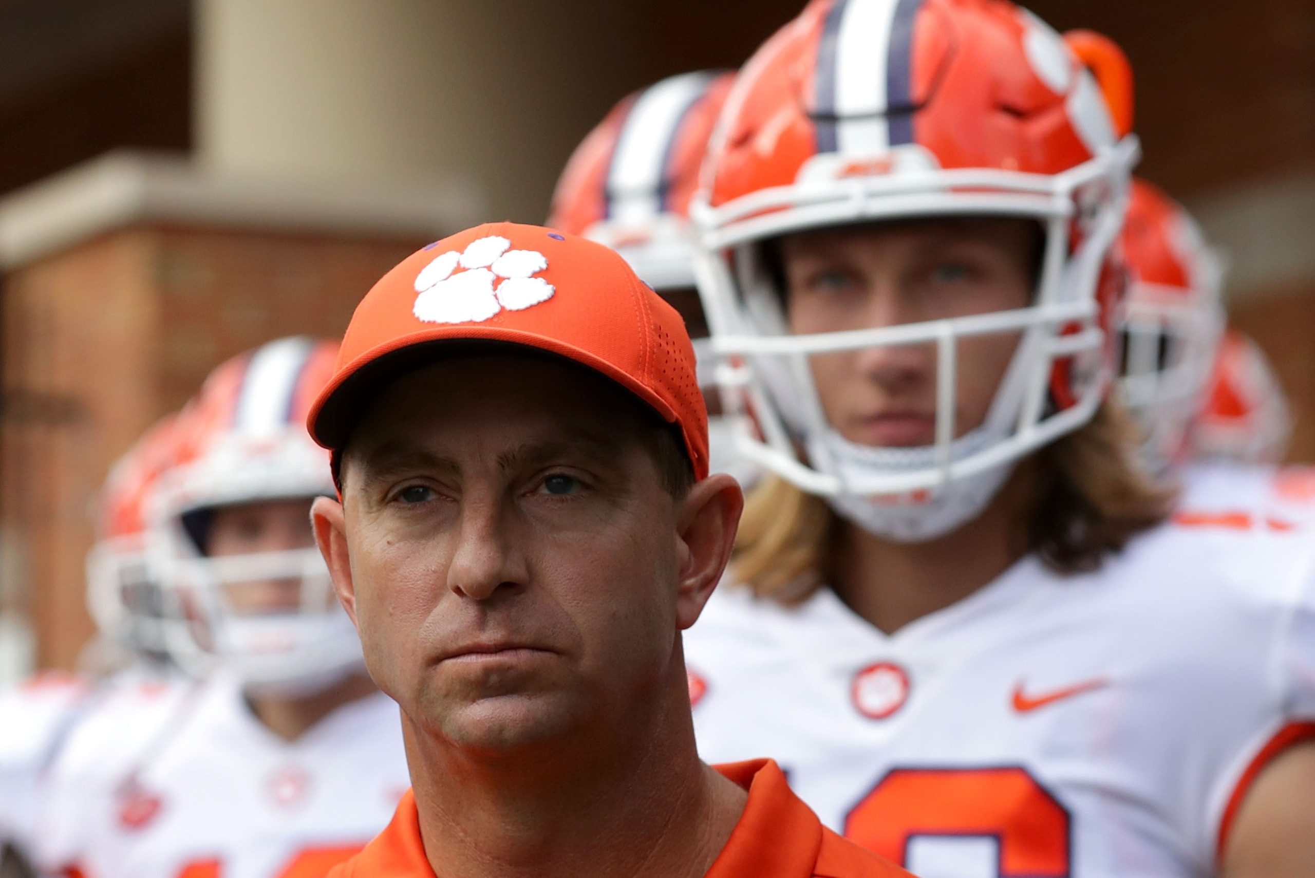 WINSTON SALEM, NC - OCTOBER 06:  Head coach Dabo Swinney of the Clemson Tigers waits to go onto the field ahead of quarterback Trevor Lawrence #16 before their game at BB&T Field on October 6, 2018 in Winston Salem, North Carolina.  (Photo by Streeter Lec