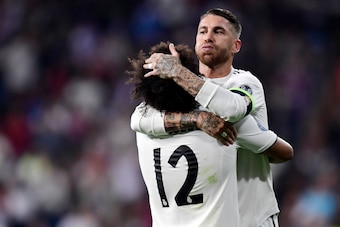 Real Madrid's Spanish defender Sergio Ramos congratulates Real Madrid's Brazilian defender Marcelo for scoring their team's second goal during the UEFA Champions League group G football match between Real Madrid CF and FC Viktoria Plzen at the Santiago Be