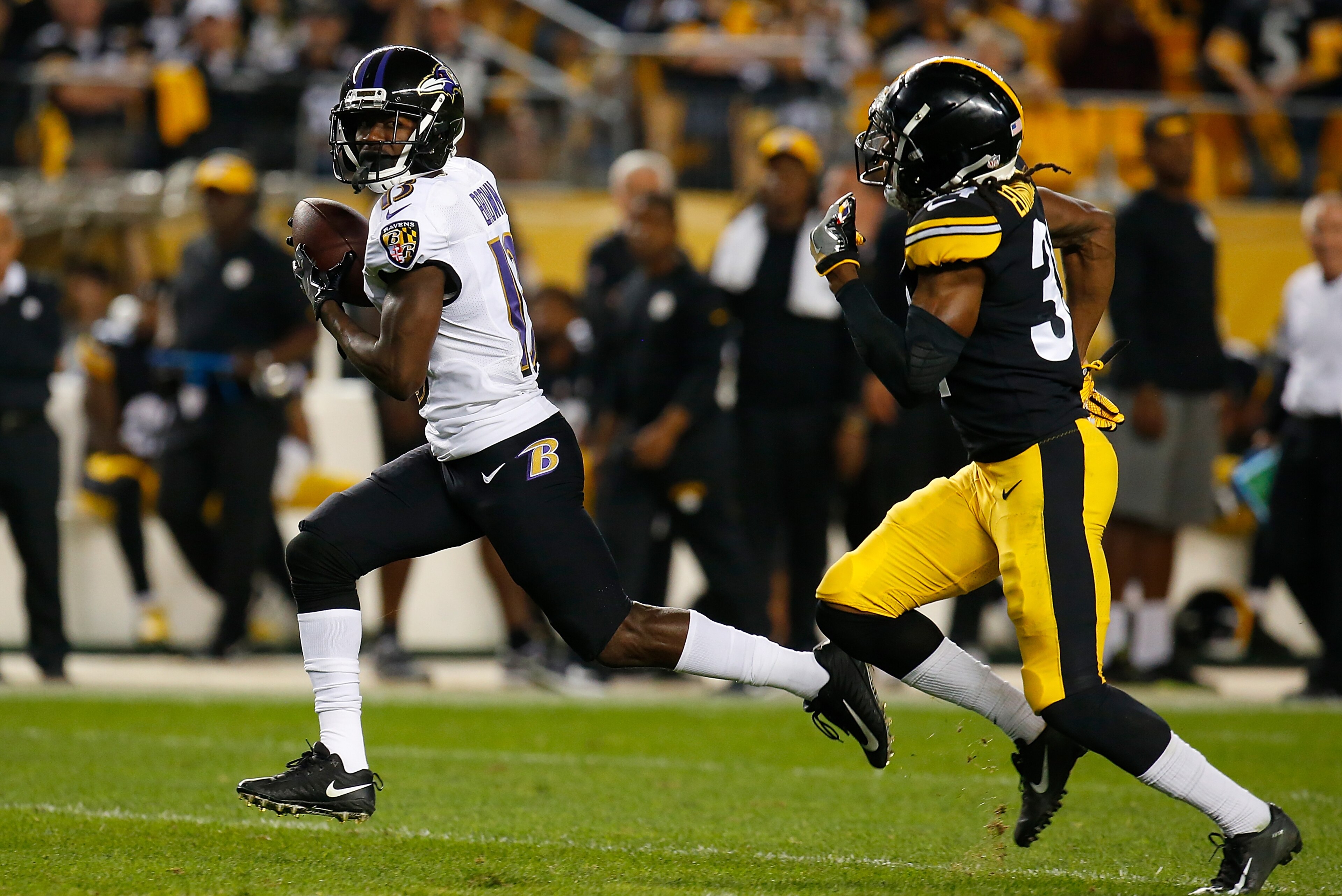 PITTSBURGH, PA - SEPTEMBER 30: John Brown #13 of the Baltimore Ravens runs upfield after a catch as Terrell Edmunds #34 of the Pittsburgh Steelers pursues in the first half during the game at Heinz Field on September 30, 2018 in Pittsburgh, Pennsylvania. 