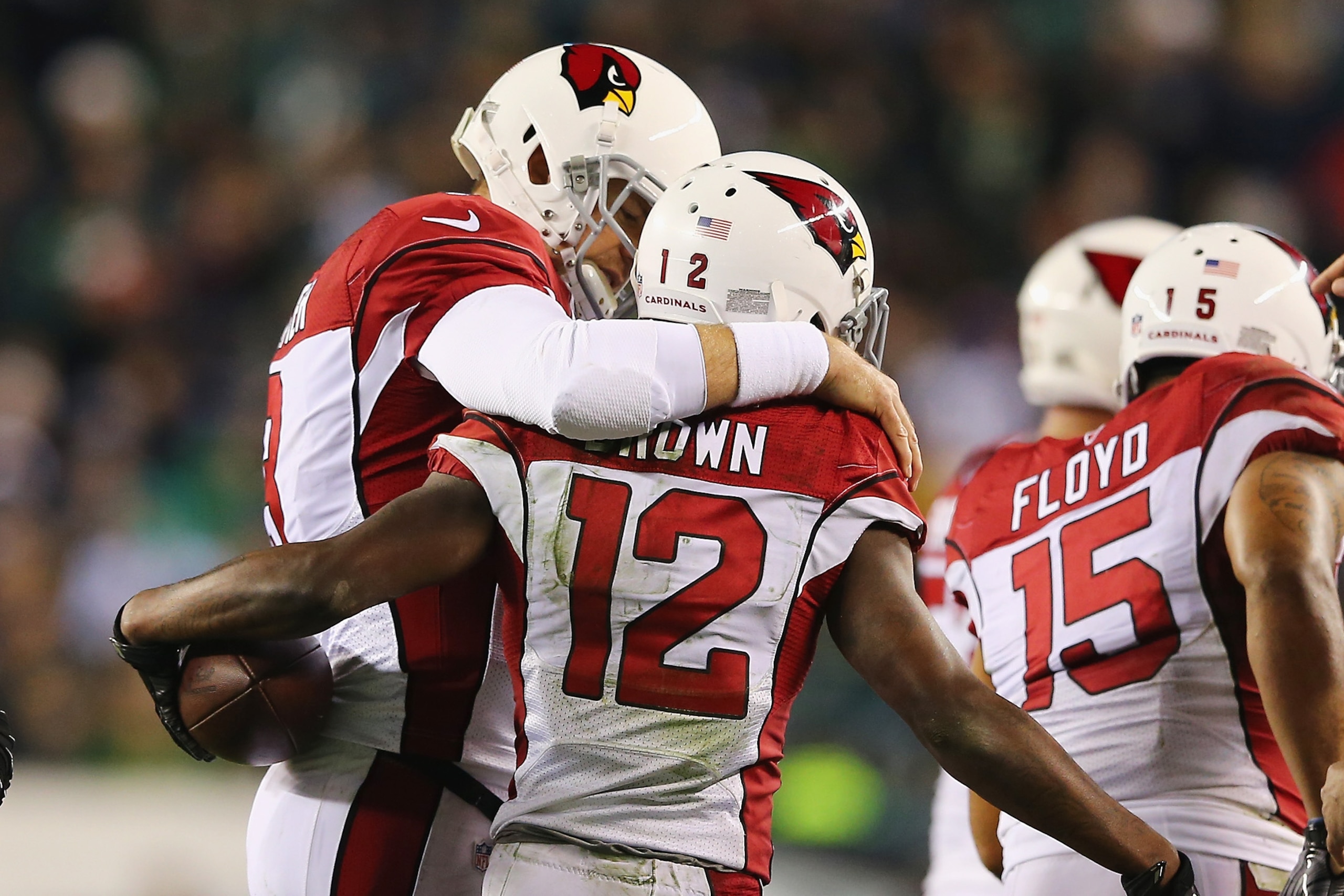 PHILADELPHIA, PA - DECEMBER 20:  John Brown #12 of the Arizona Cardinals celebrates his touchdown catch with teammate quarterback Carson Palmer #3 in the third quater against the Philadelphia Eagles at Lincoln Financial Field on December 20, 2015 in Phila