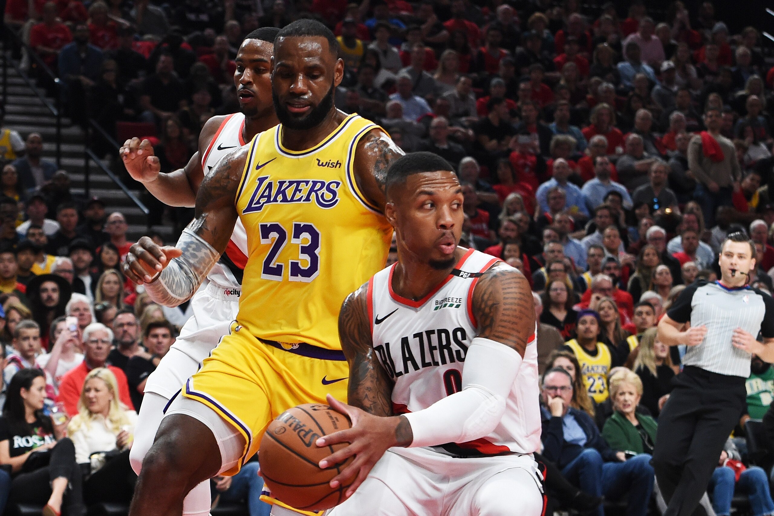 PORTLAND, OR - OCTOBER 18:  Damian Lillard #0 of the Portland Trail Blazers steals from LeBron James #23 of the Los Angeles Lakers in the first quarter of their game at Moda Center on October 18, 2018 in Portland, Oregon. NOTE TO USER: User expressly ackn