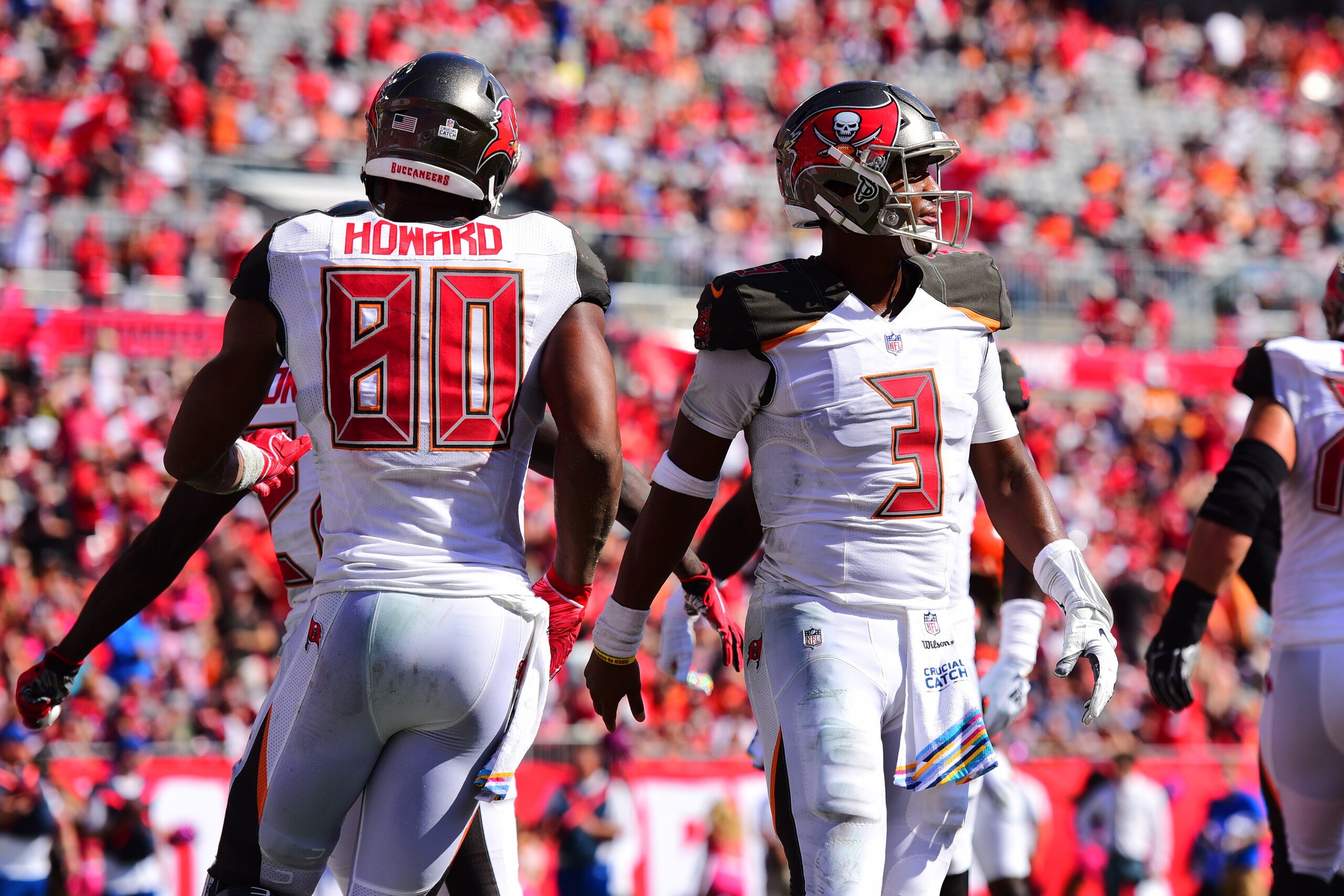 TAMPA, FL - OCTOBER 21: O.J. Howard #80 and Jameis Winston #3 of the Tampa Bay Buccaneers celebrate after a touchdown in the third quarter against the Cleveland Browns on October 21, 2018 at Raymond James Stadium in Tampa, Florida. The Buccaneers won 26-2