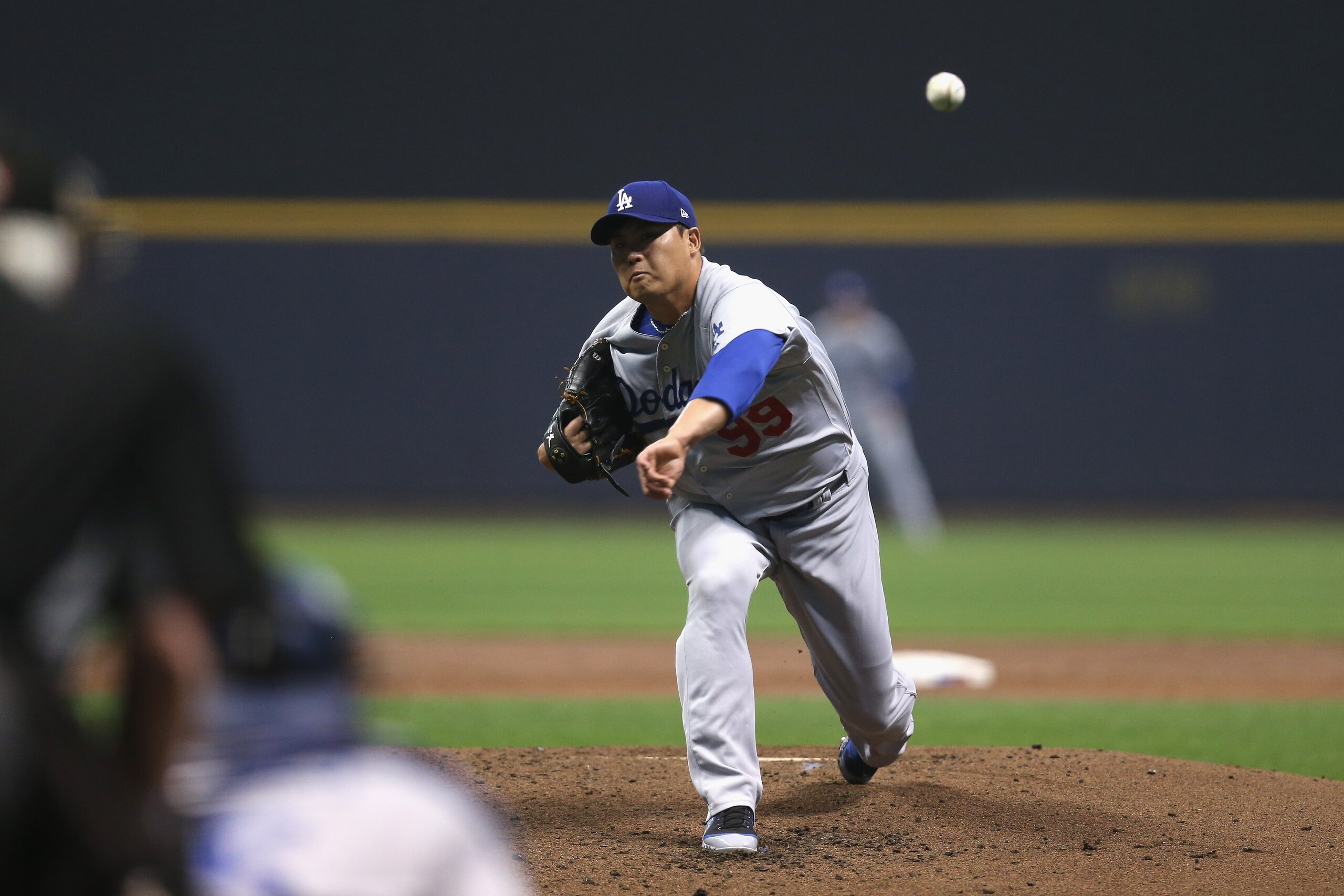 MILWAUKEE, WI - OCTOBER 19:  Hyun-Jin Ryu #99 of the Los Angeles Dodgers throws a pitch against the Milwaukee Brewers during the first inning in Game Six of the National League Championship Series at Miller Park on October 19, 2018 in Milwaukee, Wisconsin