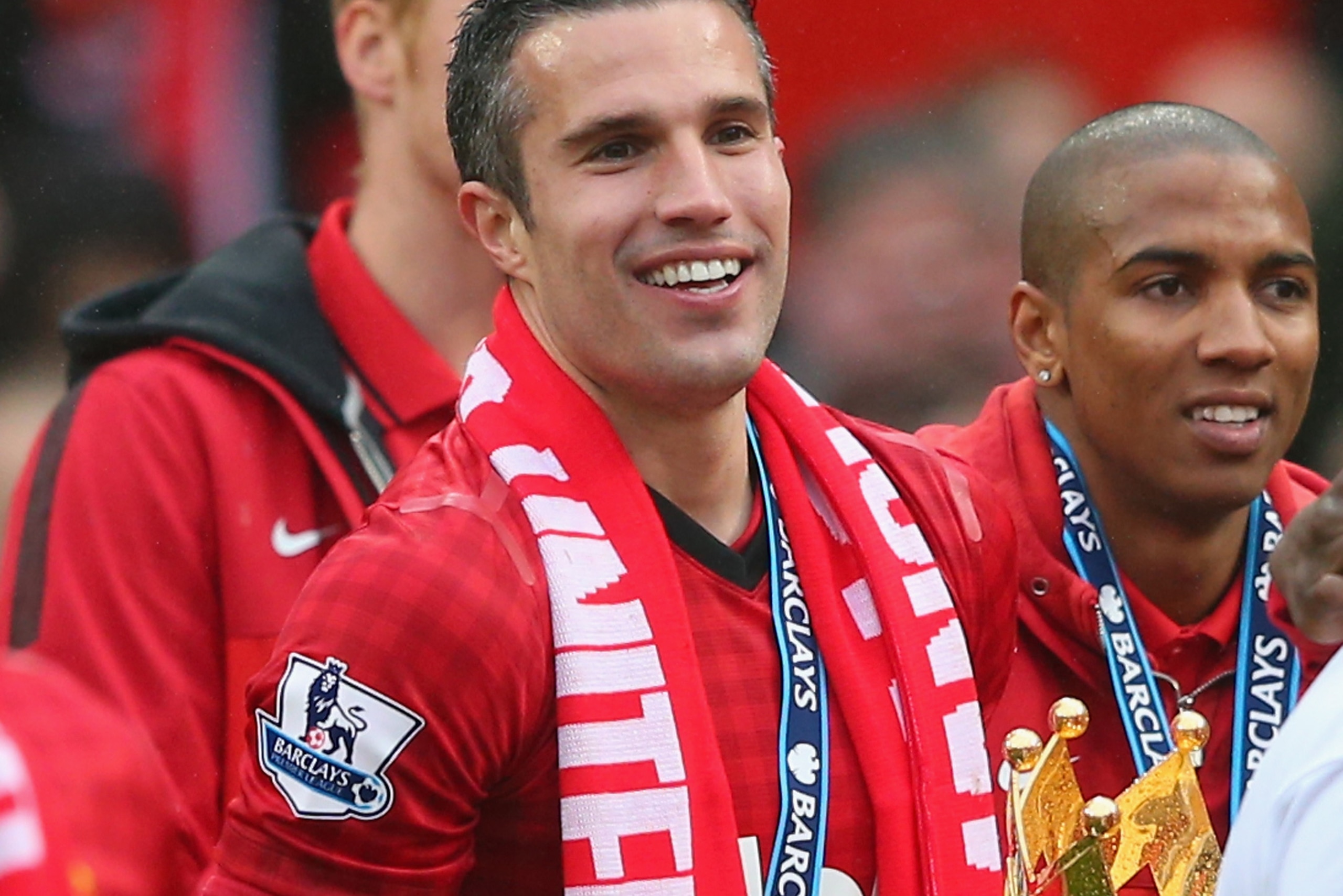 MANCHESTER, ENGLAND - MAY 12:  Robin van Persie of Manchester United celebrates with the trophy following the Barclays Premier League match between Manchester United and Swansea City at Old Trafford on May 12, 2013 in Manchester, England.  (Photo by Alex 
