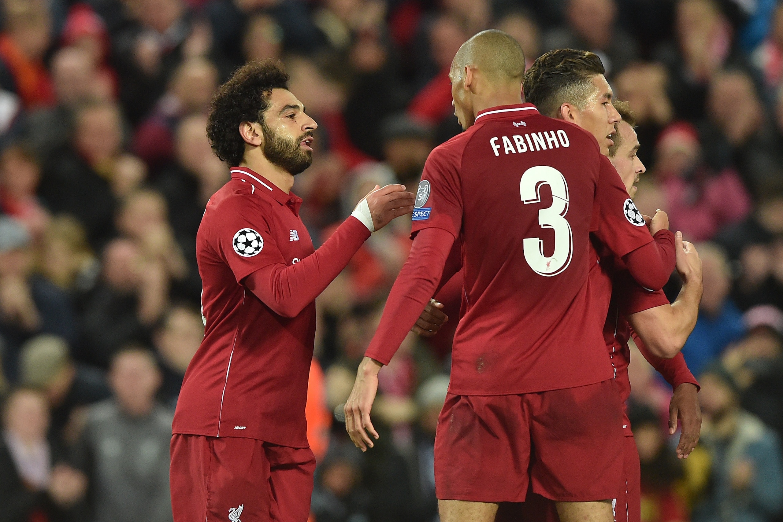 LIVERPOOL, ENGLAND - OCTOBER 24: Mohamed Salah of Liverpool celebrates his goal with team mates during the UEFA Champions League Group C match between Liverpool and FK Crvena Zvezda at Anfield on October 24, 2018 in Liverpool, United Kingdom. (Photo by TF