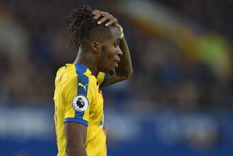 Crystal Palace's Ivorian striker Wilfried Zaha gestures during the English Premier League football match between Everton and Crystal Palace at Goodison Park in Liverpool, north west England on October 21, 2018. (Photo by Oli SCARFF / AFP) / RESTRICTED TO 