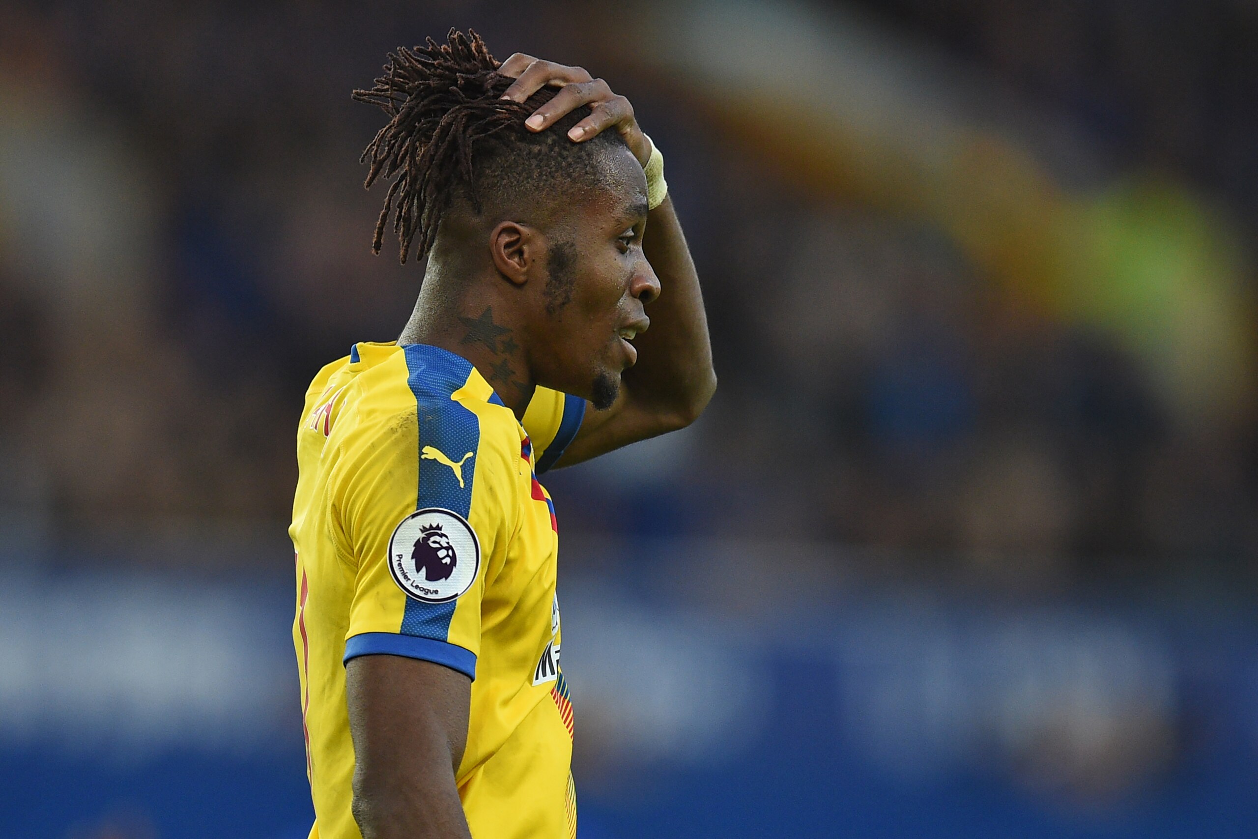 Crystal Palace's Ivorian striker Wilfried Zaha gestures during the English Premier League football match between Everton and Crystal Palace at Goodison Park in Liverpool, north west England on October 21, 2018. (Photo by Oli SCARFF / AFP) / RESTRICTED TO Crystal Palace's Ivorian striker Wilfried Zaha gestures during the English Premier League football match between Everton and Crystal Palace at Goodison Park in Liverpool, north west England on October 21, 2018. (Photo by Oli SCARFF / AFP) / RESTRICTED TO