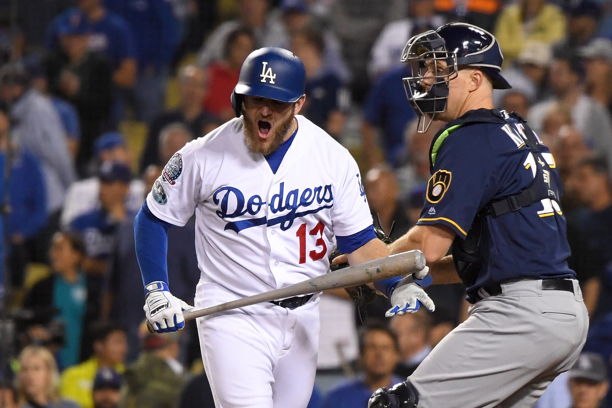 LOS ANGELES, CA - OCTOBER 16:  Max Muncy #13 of the Los Angeles Dodgers reacts after striking out against the Milwaukee Brewers during the tenth inning in Game Four of the National League Championship Series at Dodger Stadium on October 16, 2018 in Los An