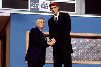NEW YORK - 2001: Pau Gasol shakes hands with NBA Commissioner David Stern after he was selected by the Atlanta Hawks during the 2001 NBA Draft at the Paramount Theatre in New York, New York.  NOTE TO USER: User expressly acknowledges that, by downloading 