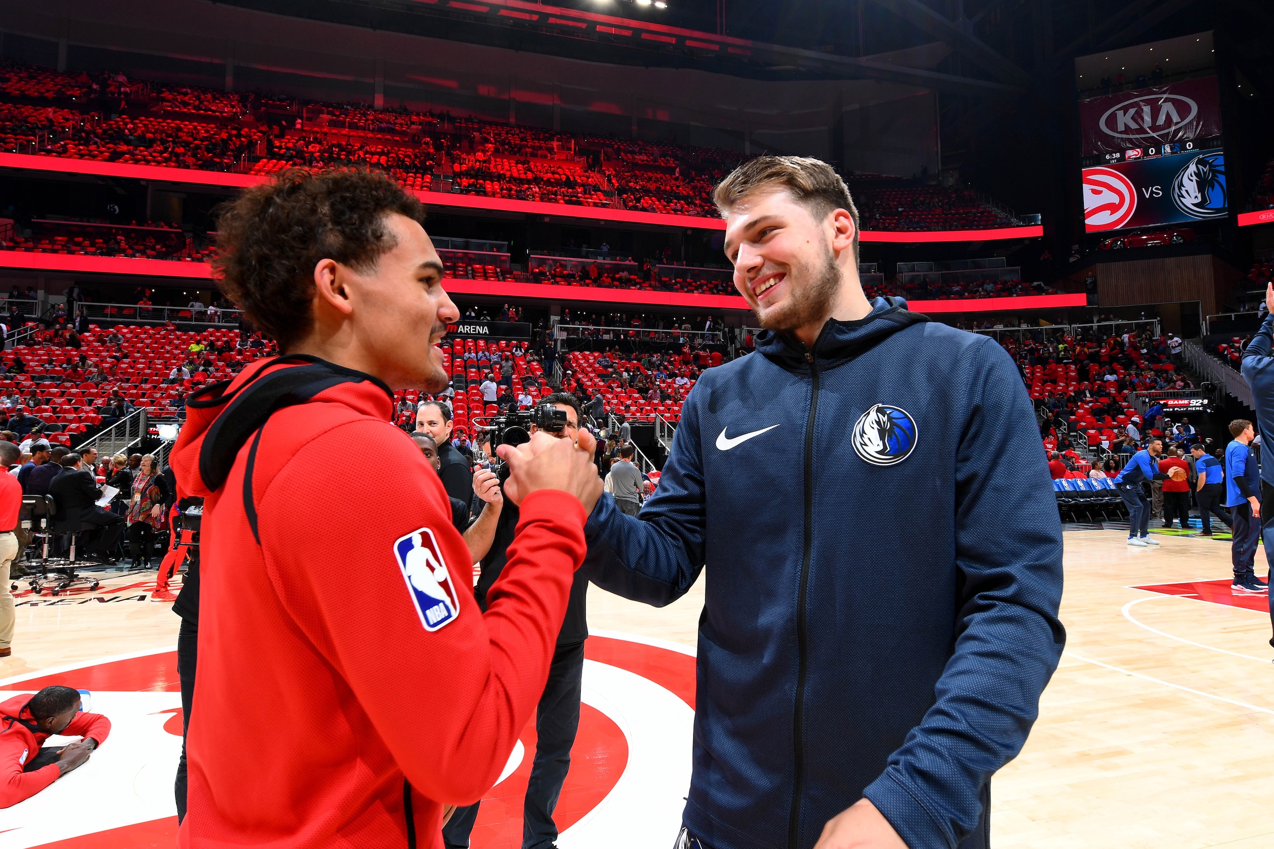 ATLANTA, GA - OCTOBER 24: Trae Young #11 of the Atlanta Hawks and Luka Doncic #77 of the Dallas Mavericks talk before the game on October 24, 2018 at State Farm Arena in Atlanta, Georgia. NOTE TO USER: User expressly acknowledges and agrees that, by downl
