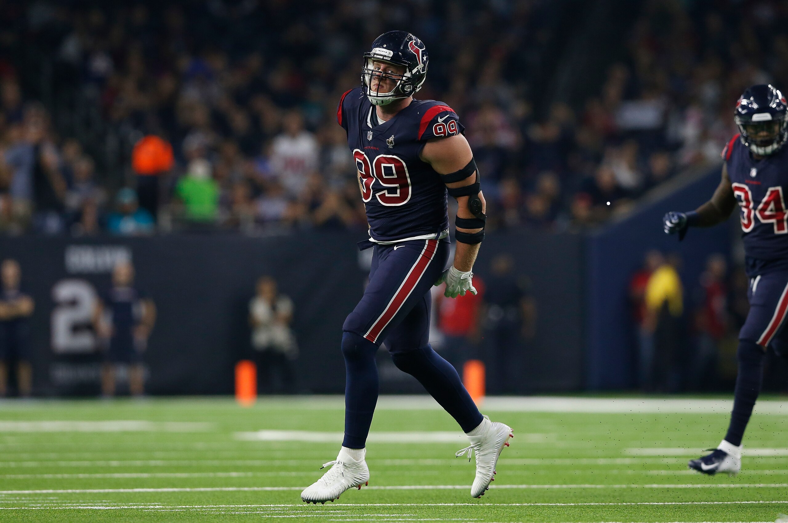 HOUSTON, TX - OCTOBER 25:  J.J. Watt #99 of the Houston Texans celebrates a tackle for a loss against the Miami Dolphins in the first quarter at NRG Stadium on October 25, 2018 in Houston, Texas.  (Photo by Tim Warner/Getty Images)