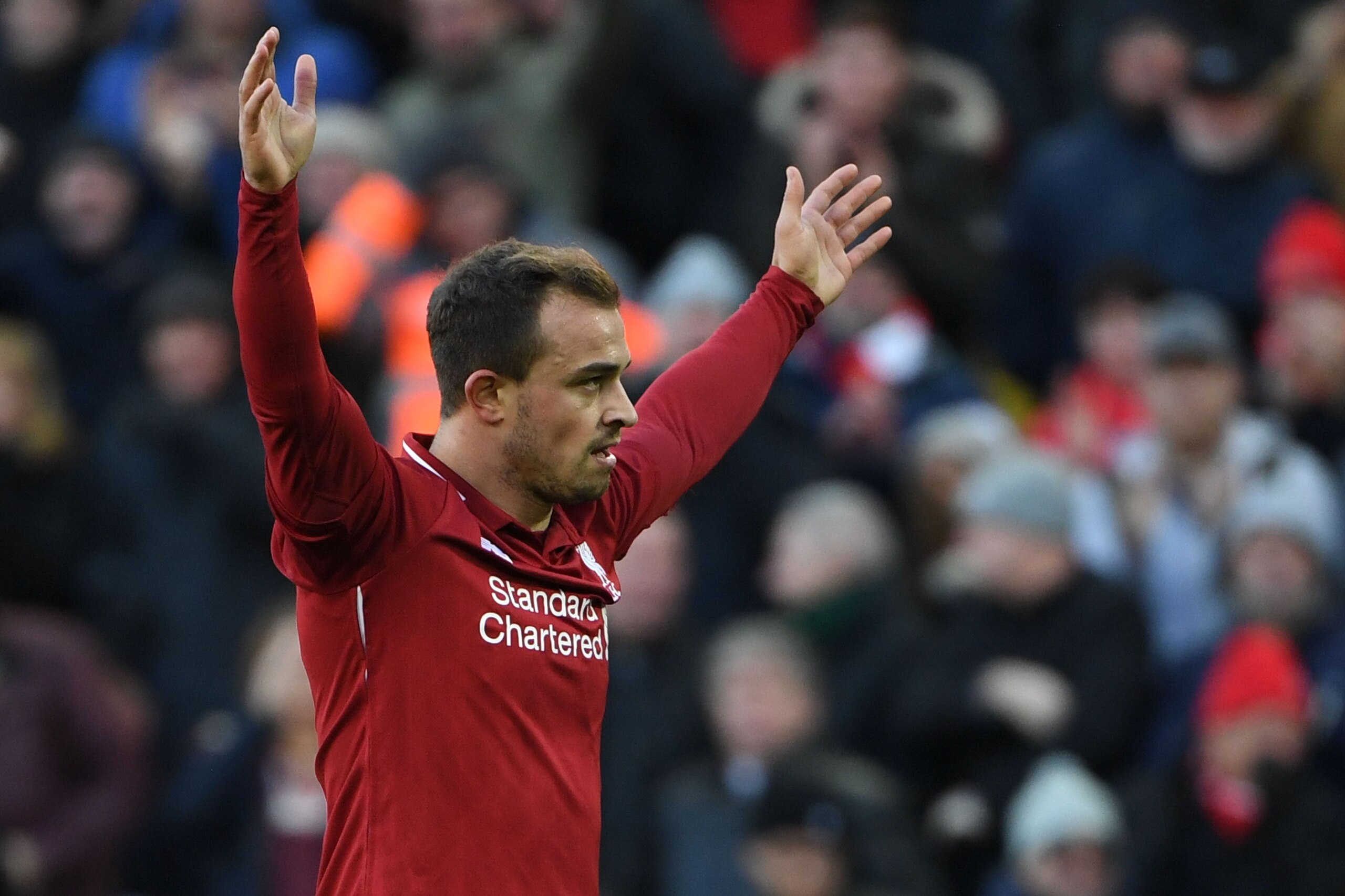Liverpool's Swiss midfielder Xherdan Shaqiri celebrates scoring their third goal during the English Premier League football match between Liverpool and Cardiff City at Anfield in Liverpool, north west England on October 27, 2018. (Photo by Paul ELLIS / AF