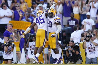 BATON ROUGE, LA - OCTOBER 13: Michael Divinity Jr. #45 of the LSU Tigers and Devin White #40 celebrates during a game against the Georgia Bulldogs at Tiger Stadium on October 13, 2018 in Baton Rouge, Louisiana.  (Photo by Jonathan Bachman/Getty Images)