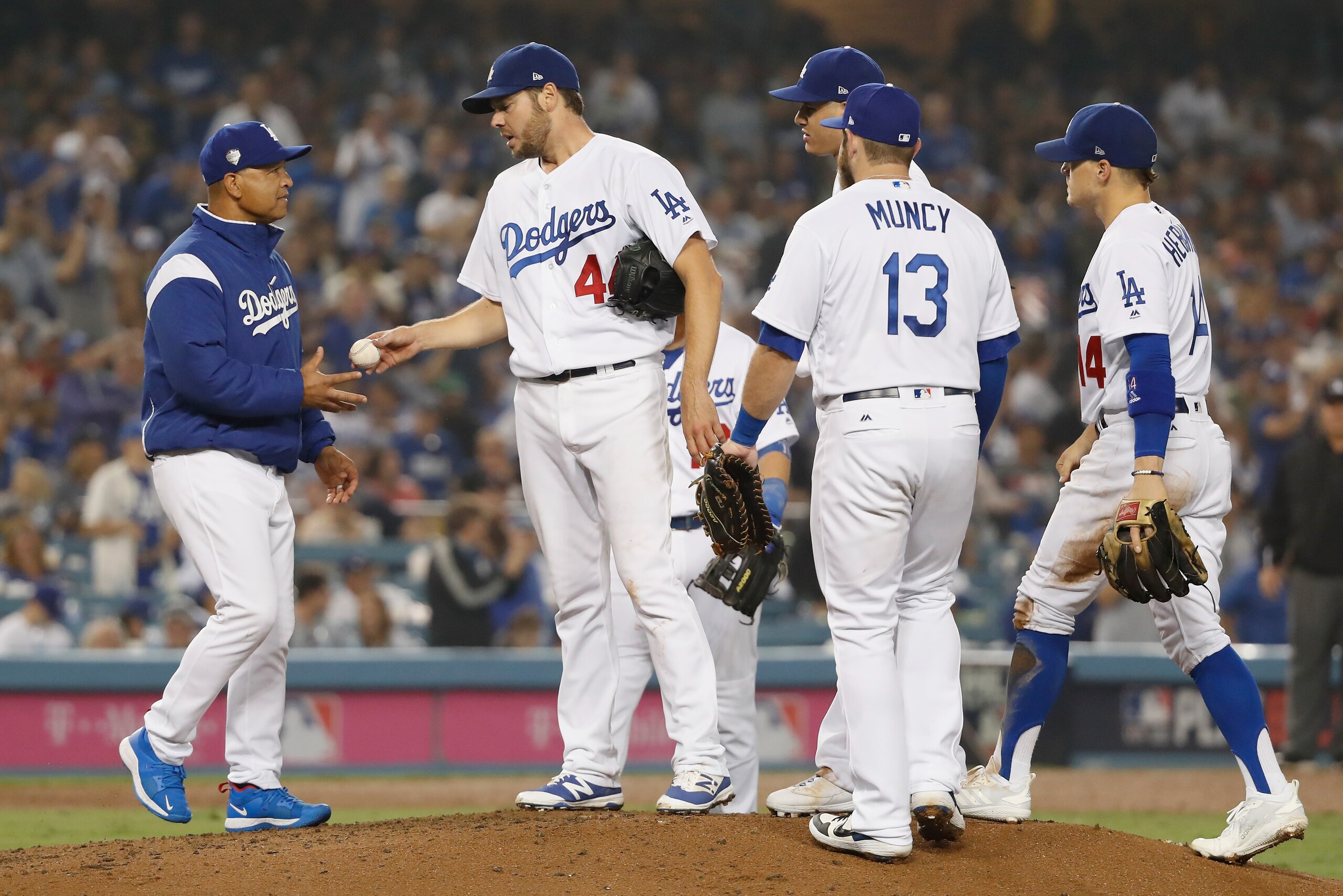 LOS ANGELES, CA - OCTOBER 27:  Pitcher Rich Hill #44 of the Los Angeles Dodgers gives the ball to manager Dave Roberts #30 as Roberts takes Hill out of the game in the seventh inning of Game Four of the 2018 World Series against the Boston Red Sox at Dodg