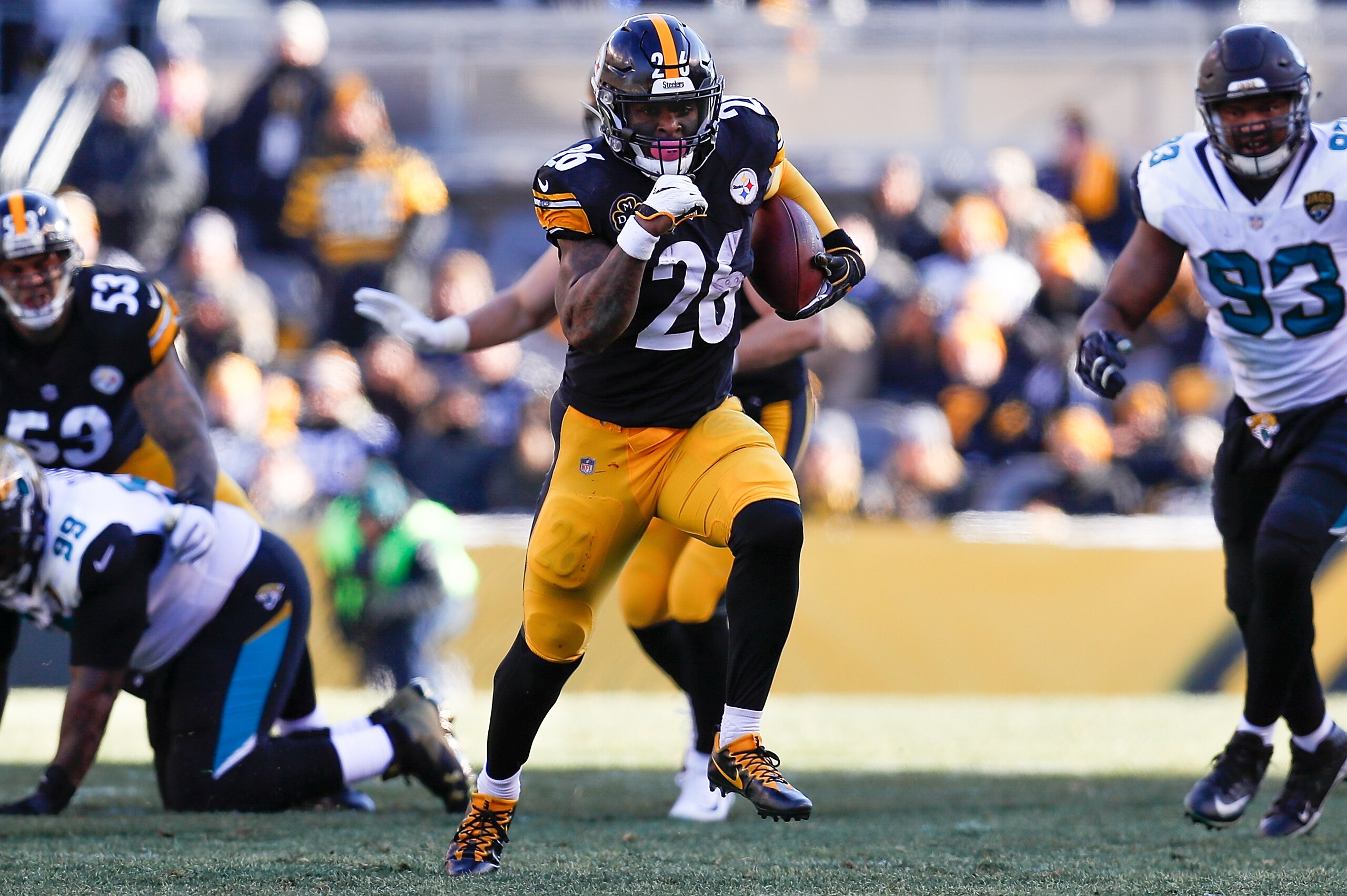 PITTSBURGH, PA - JANUARY 14:  Le'Veon Bell #26 of the Pittsburgh Steelers runs with the ball against the Jacksonville Jaguars during the first half of the AFC Divisional Playoff game at Heinz Field on January 14, 2018 in Pittsburgh, Pennsylvania.  (Photo 