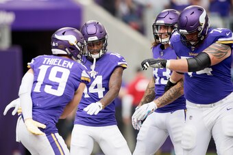 MINNEAPOLIS, MN - OCTOBER 14: Adam Thielen #19, Stefon Diggs #14, Tyler Conklin #83 and Mike Remmers #74 of the Minnesota Vikings celebrate a touchdown Thielen during the game against the Arizona Cardinals at U.S. Bank Stadium on October 14, 2018 in Minne