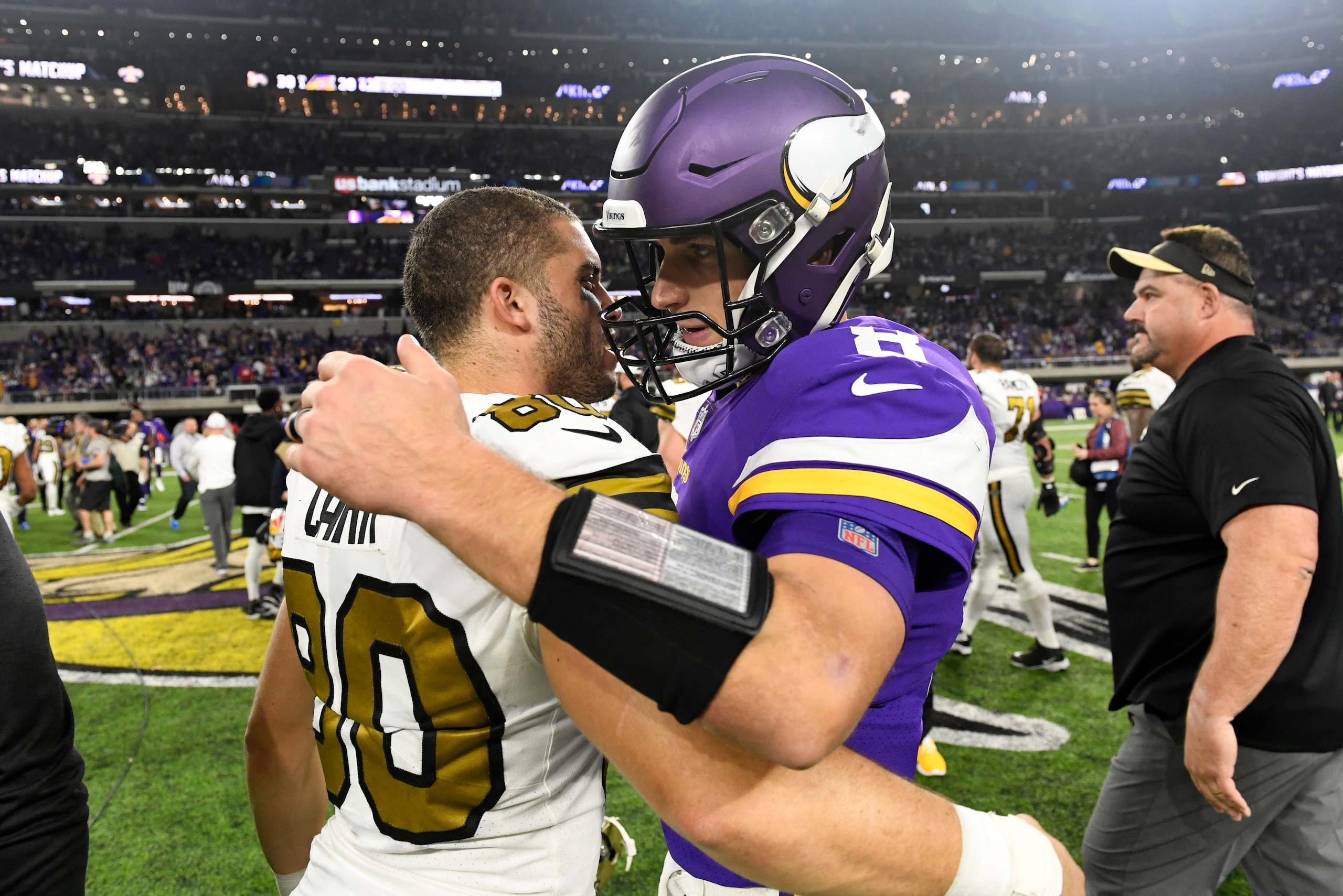 MINNEAPOLIS, MN - OCTOBER 28: Kirk Cousins #8 of the Minnesota Vikings and Austin Carr #80 of the New Orleans Saints embrace after the game at U.S. Bank Stadium on October 28, 2018 in Minneapolis, Minnesota. The Saints defeated the Vikings 30-20 (Photo by