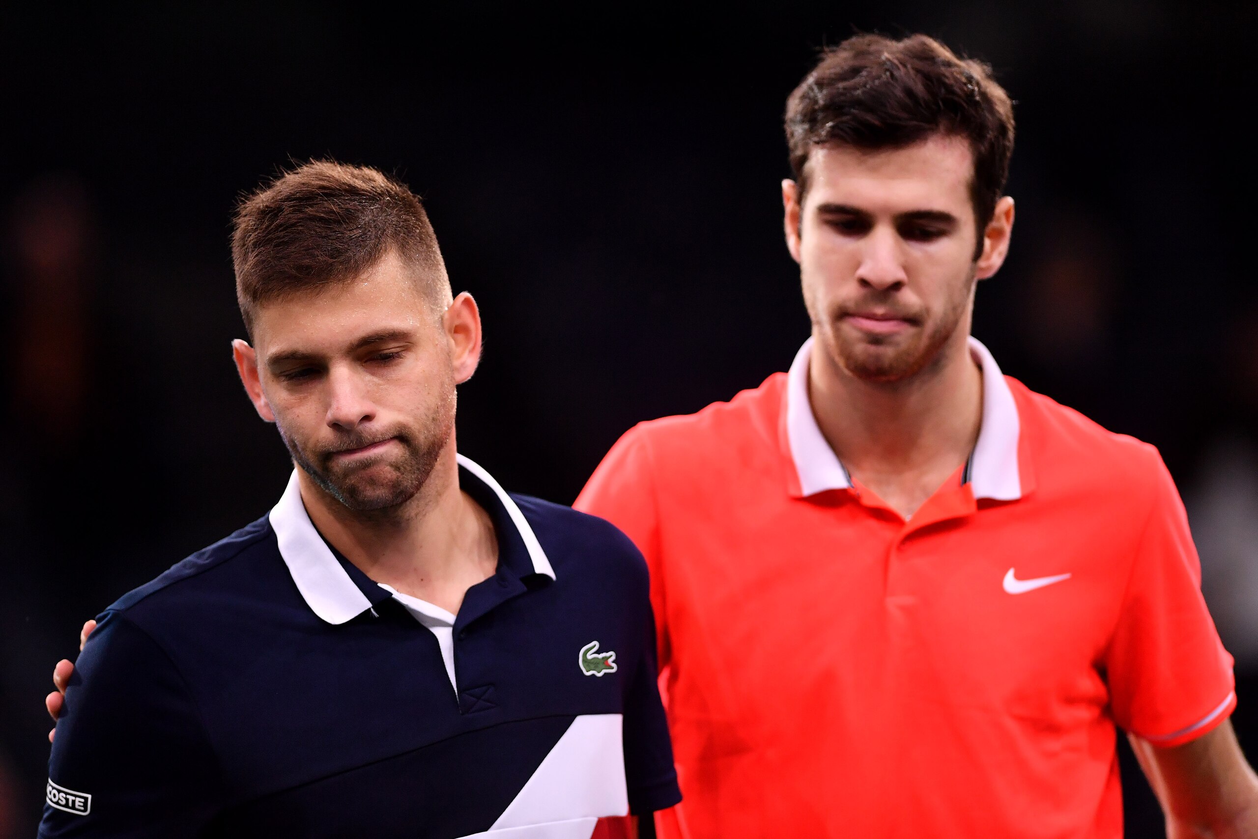 PARIS, FRANCE - OCTOBER 29: Karen Khachanov of 
Russia consoles Filip Krajinovic of Serbia after winning his match on Day 1 of the Rolex Paris Masters on October 29, 2018 in Paris, France. (Photo by Justin Setterfield/Getty Images)
