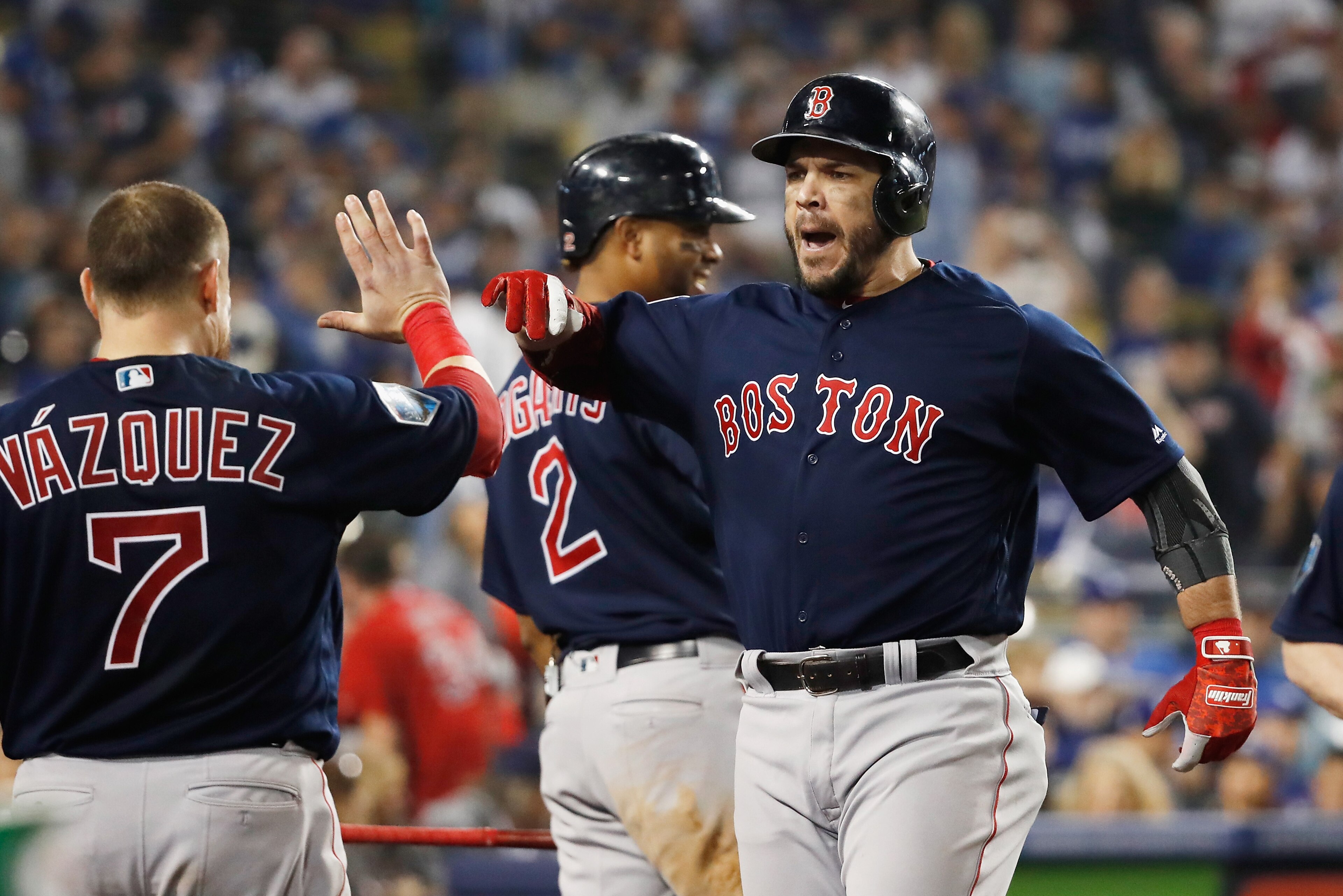 LOS ANGELES, CA - OCTOBER 28:  Steve Pearce #25 of the Boston Red Sox is congratulated by his teammates after his eighth inning home run against the Los Angeles Dodgers in Game Five of the 2018 World Series at Dodger Stadium on October 28, 2018 in Los Ang