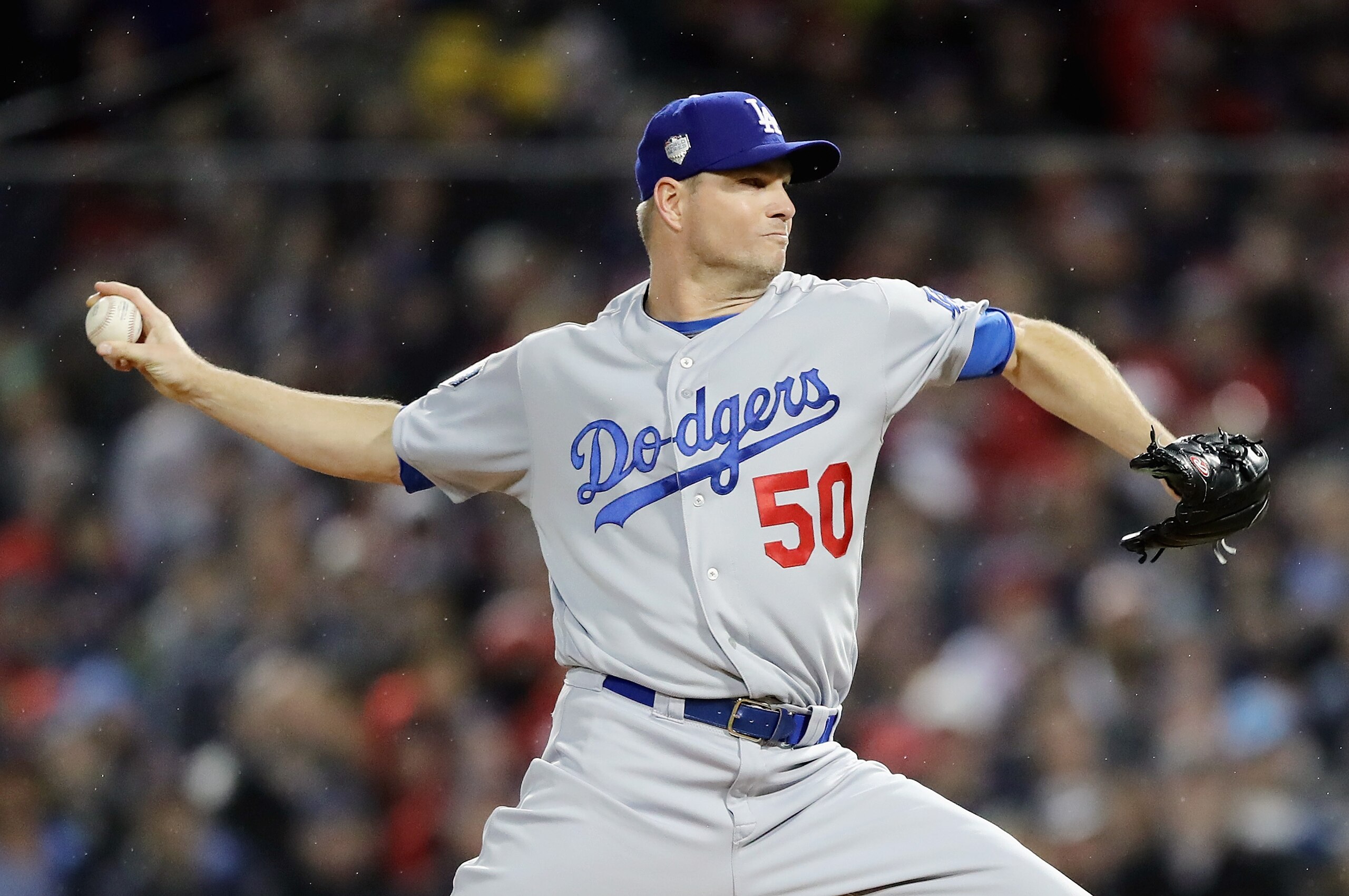 BOSTON, MA - OCTOBER 23:  Ryan Madson #50 of the Los Angeles Dodgers delivers the pitch during the fifth inning against the Boston Red Sox in Game One of the 2018 World Series at Fenway Park on October 23, 2018 in Boston, Massachusetts.  (Photo by Elsa/Ge