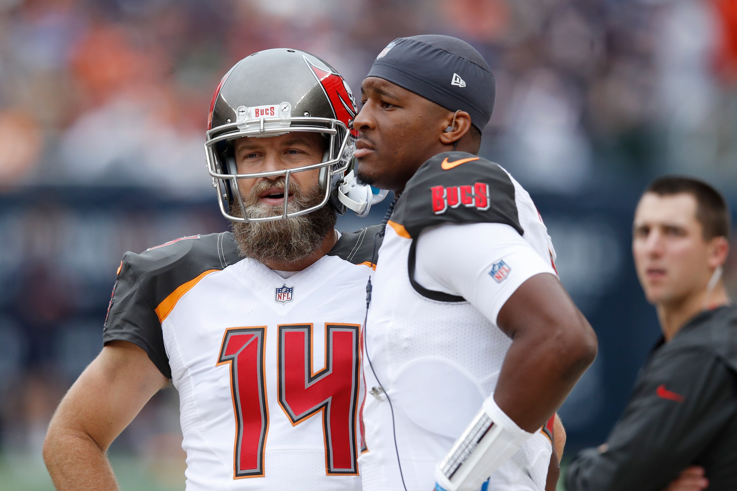CHICAGO, IL - SEPTEMBER 30: Ryan Fitzpatrick #14 of the Tampa Bay Buccaneers looks on while standing next to Jameis Winston #3 on the sideline during the game against the Chicago Bears at Soldier Field on September 30, 2018 in Chicago, Illinois. The Bears