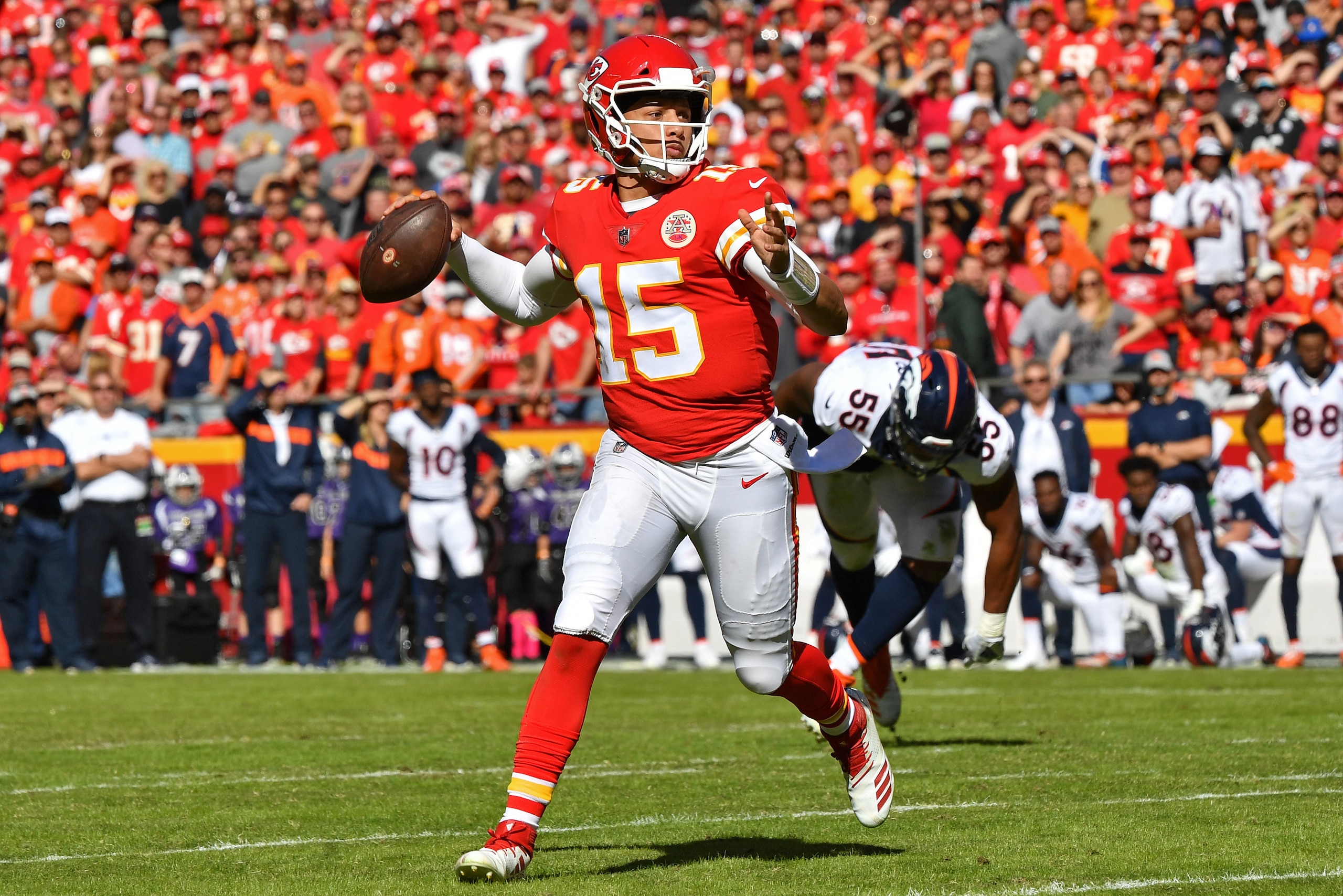 KANSAS CITY, MO - OCTOBER 28:  Quarterback Patrick Mahomes #15 of the Kansas City Chiefs looks down field to throw a pass during the first half against the Denver Broncos on October 28, 2018 at Arrowhead Stadium in Kansas City, Missouri.  (Photo by Peter 