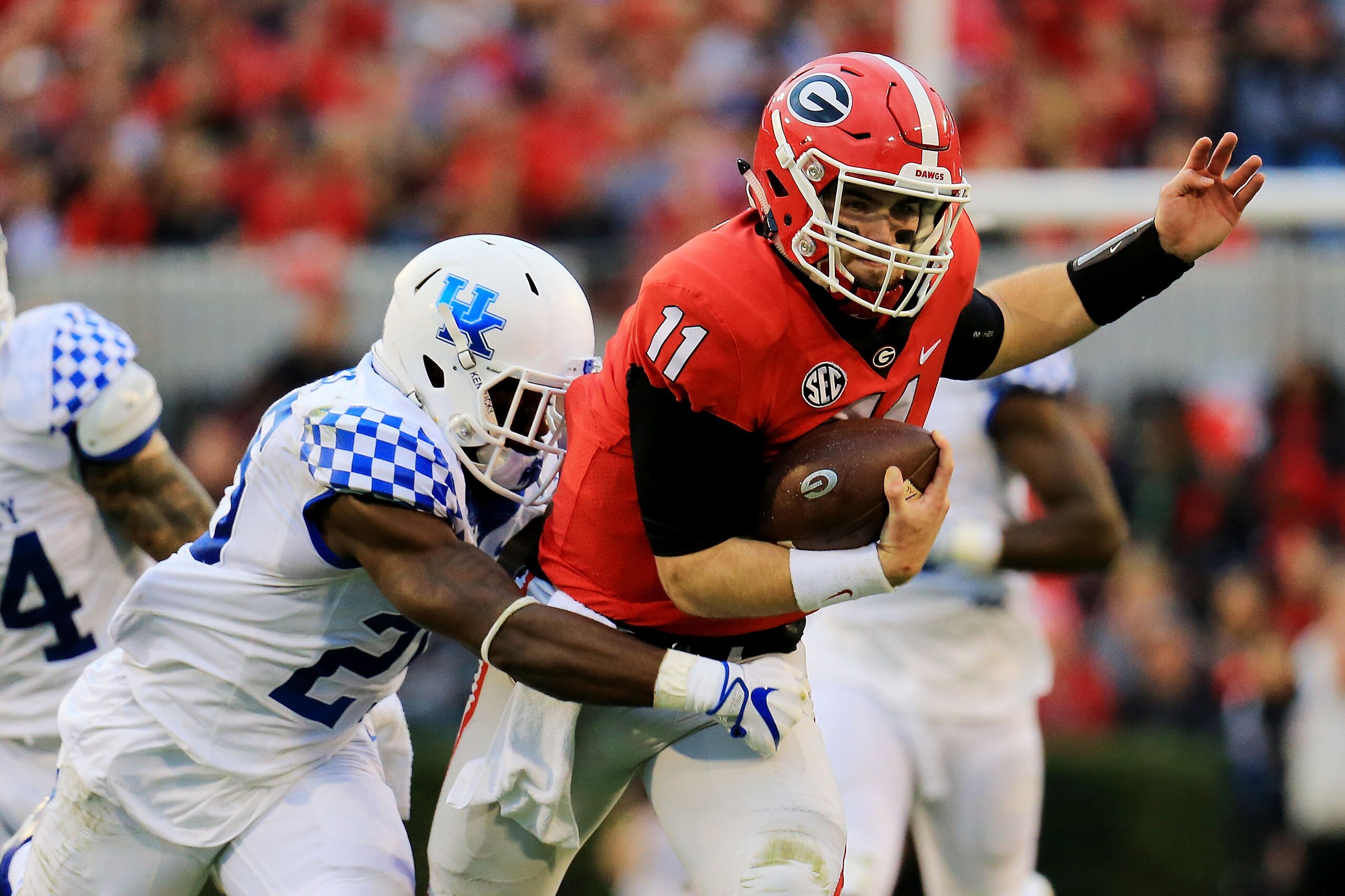 ATHENS, GA - NOVEMBER 18: Jake Fromm #11 of the Georgia Bulldogs is tackled on a run by Kengera Daniel #20 of the Kentucky Wildcats during the first half at Sanford Stadium on November 18, 2017 in Athens, Georgia. (Photo by Daniel Shirey/Getty Images) ATHENS, GA - NOVEMBER 18: Jake Fromm #11 of the Georgia Bulldogs is tackled on a run by Kengera Daniel #20 of the Kentucky Wildcats during the first half at Sanford Stadium on November 18, 2017 in Athens, Georgia. (Photo by Daniel Shirey/Getty Images)