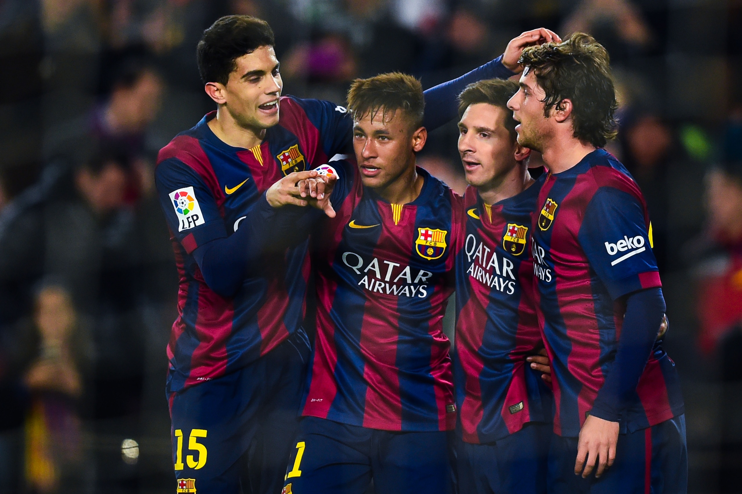 BARCELONA, SPAIN - JANUARY 08:  Neymar (2ndL) of FC Barcelona  celebrates with his teammates (L-R) Marc Bartra, Lionel Messi and Sergio Roberto scoring the opening goal during the Copa del Rey Round of 16 First Leg match between FC Barcelona and Elche CF 