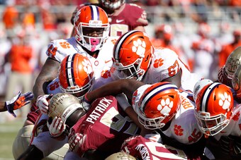 TALLAHASSEE, FL - OCTOBER 27: A group of Clemson Tigers defenders make a tackle for loss against Jacques Patrick #9 of the Florida State Seminoles during the game at Doak Campbell Stadium on October 27, 2018 in Tallahassee, Florida. Clemson won 59-10. (Ph