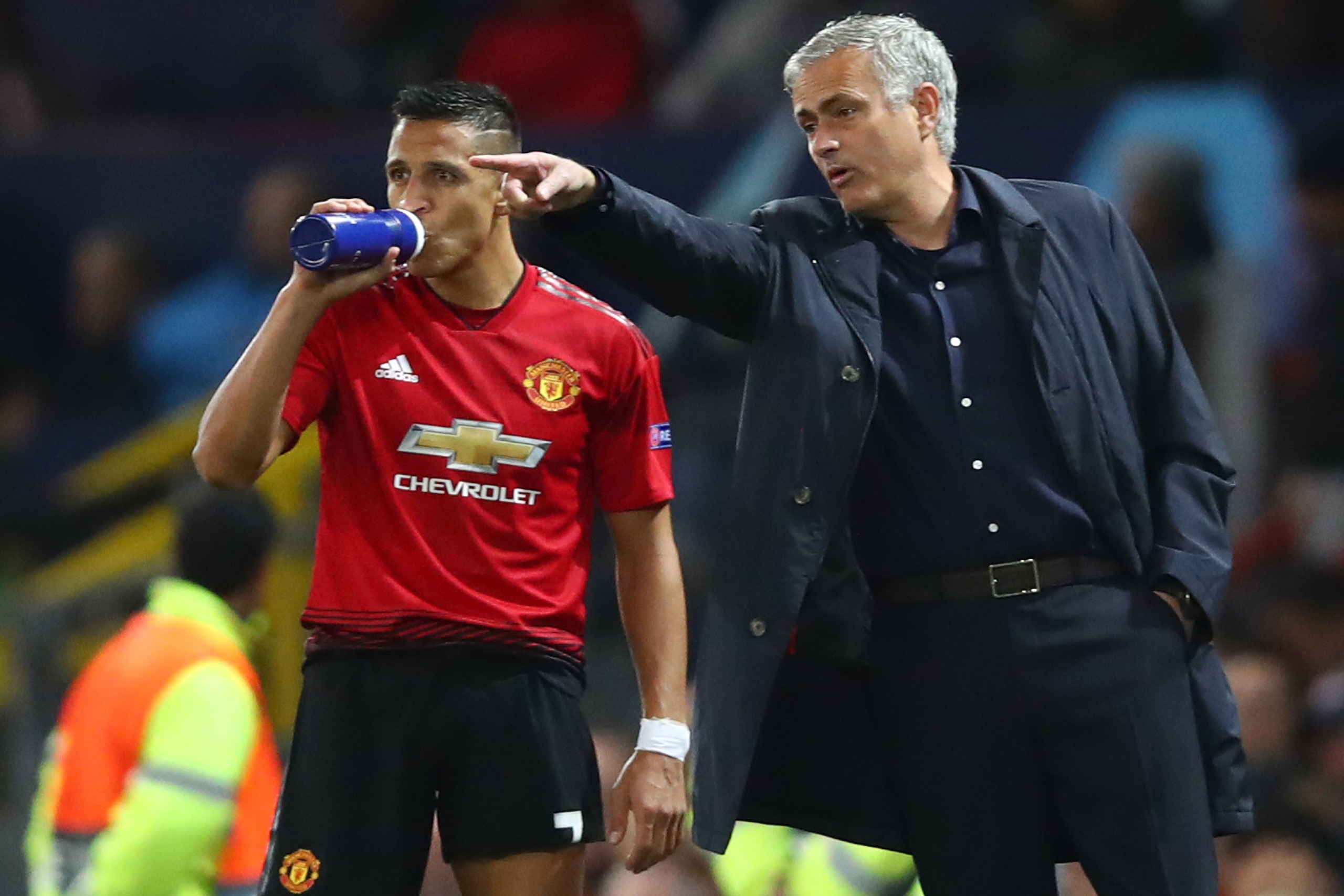 MANCHESTER, ENGLAND - OCTOBER 02:  Jose Mourinho, Manager of Manchester United gives Alexis Sanchez of Manchester United instructions during the Group H match of the UEFA Champions League between Manchester United and Valencia at Old Trafford on October 2