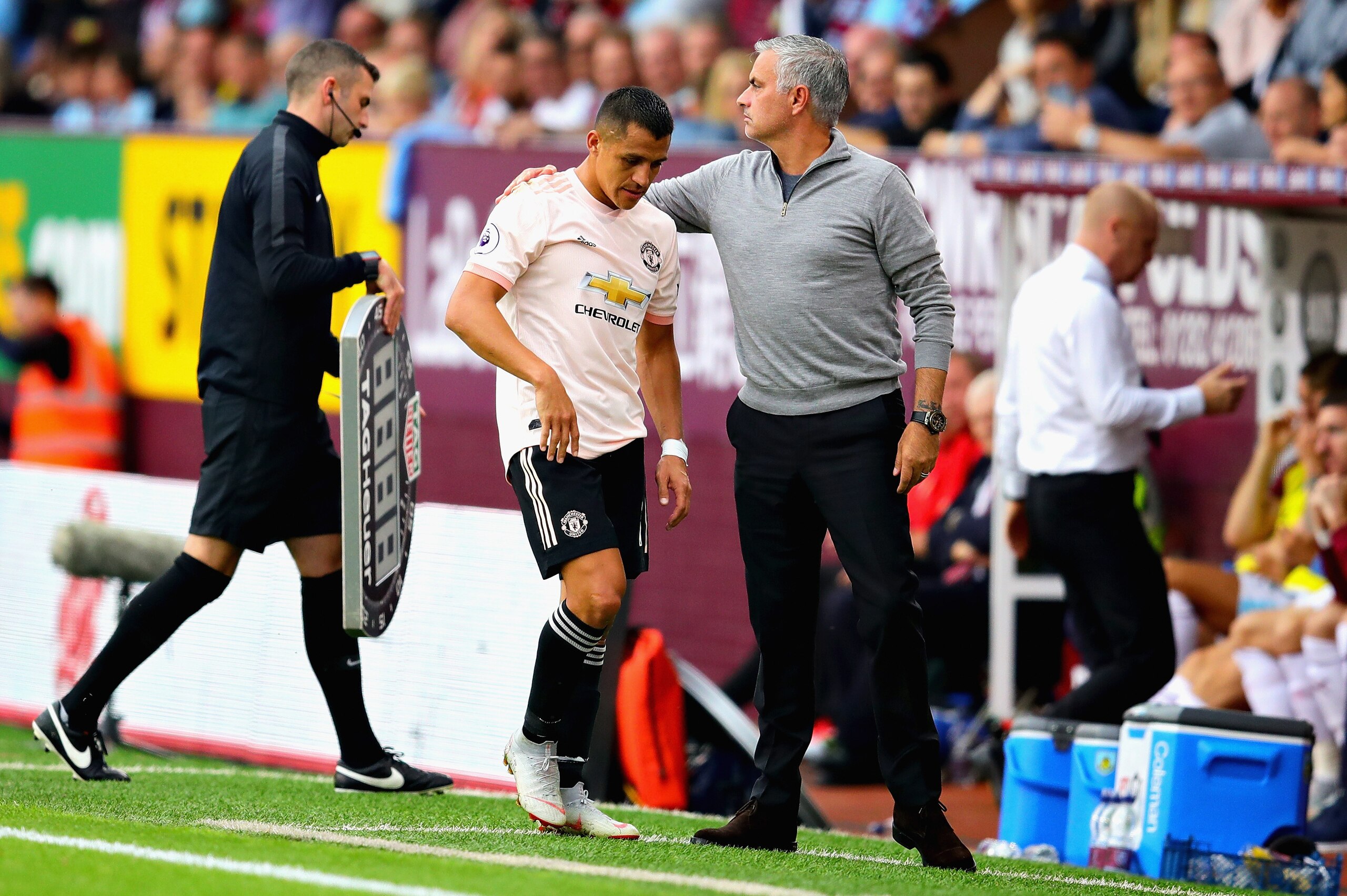 BURNLEY, ENGLAND - SEPTEMBER 02: Alexis Sanchez of Manchester United is hugged by Manager of Manchester United Jose Mourinho after being substituted during the Premier League match between Burnley FC and Manchester United at Turf Moor on September 2, 2018
