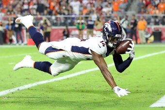 GLENDALE, AZ - OCTOBER 18:  Wide receiver Courtland Sutton #14 of the Denver Broncos scores a 28-yard touchdown during the first quarter against the Arizona Cardinals at State Farm Stadium on October 18, 2018 in Glendale, Arizona.  (Photo by Christian Pet