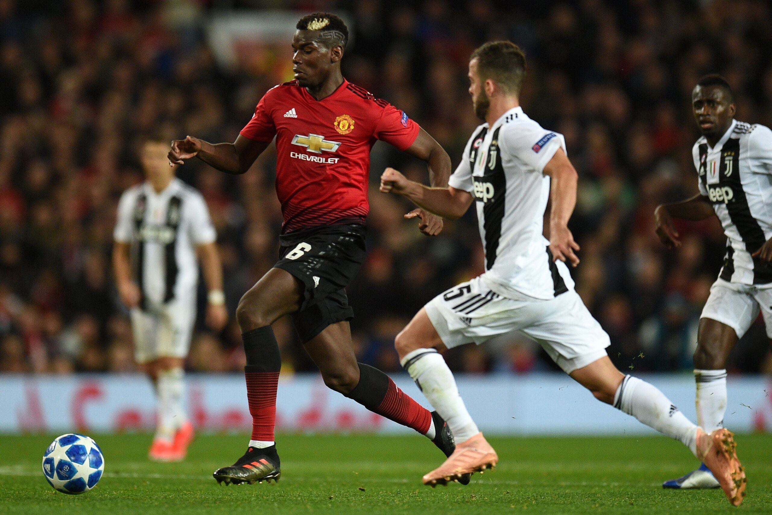 Manchester United's French midfielder Paul Pogba (L) vies with Juventus' Bosnian midfielder Miralem Pjanic (R) during the Champions League group H football match between Manchester United and Juventus at Old Trafford in Manchester, north west England, on 